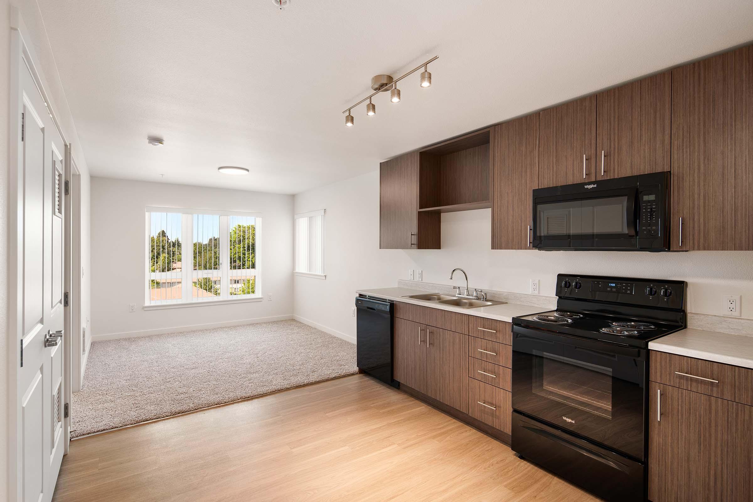 a kitchen with a wood floor