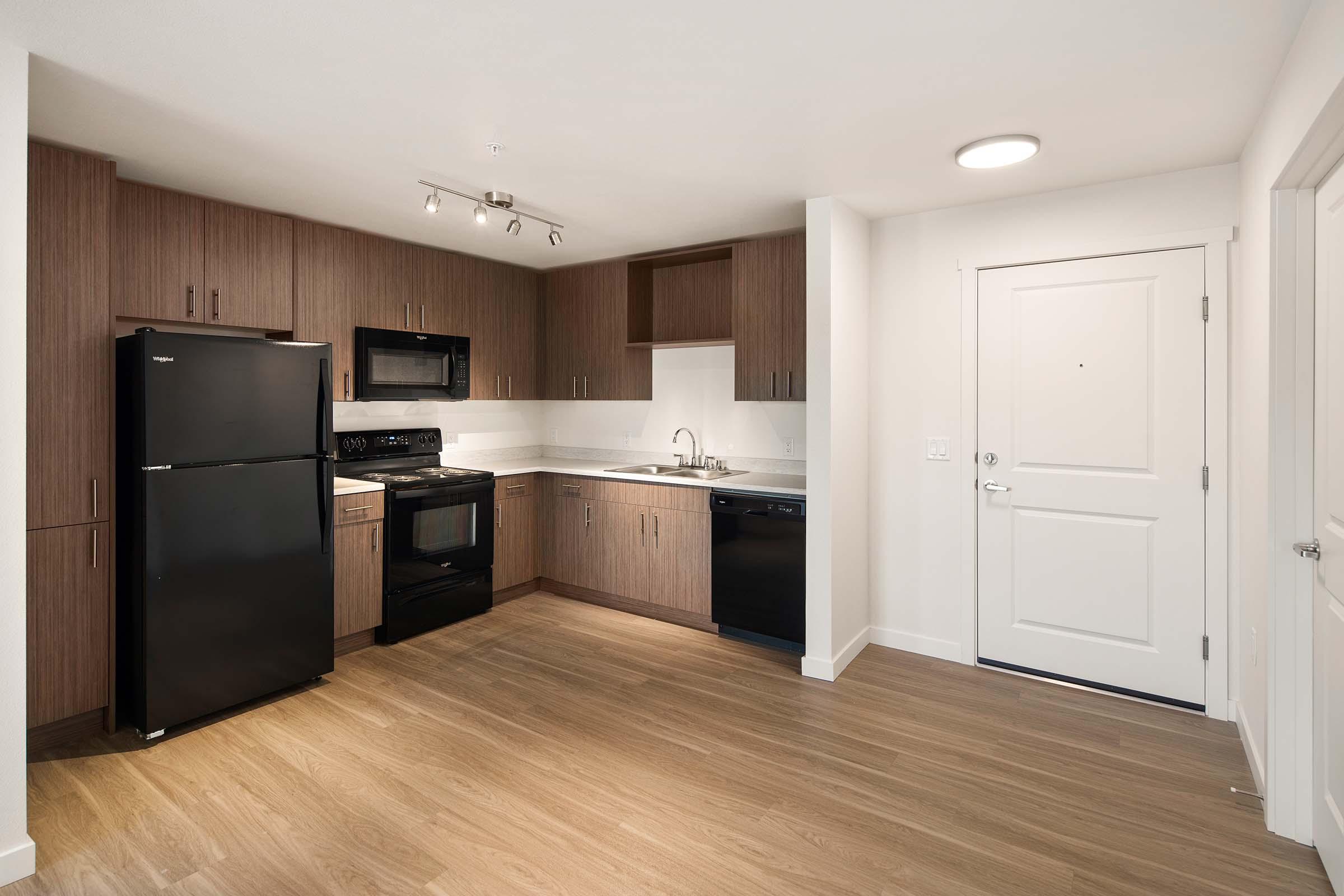 a kitchen with a wood floor