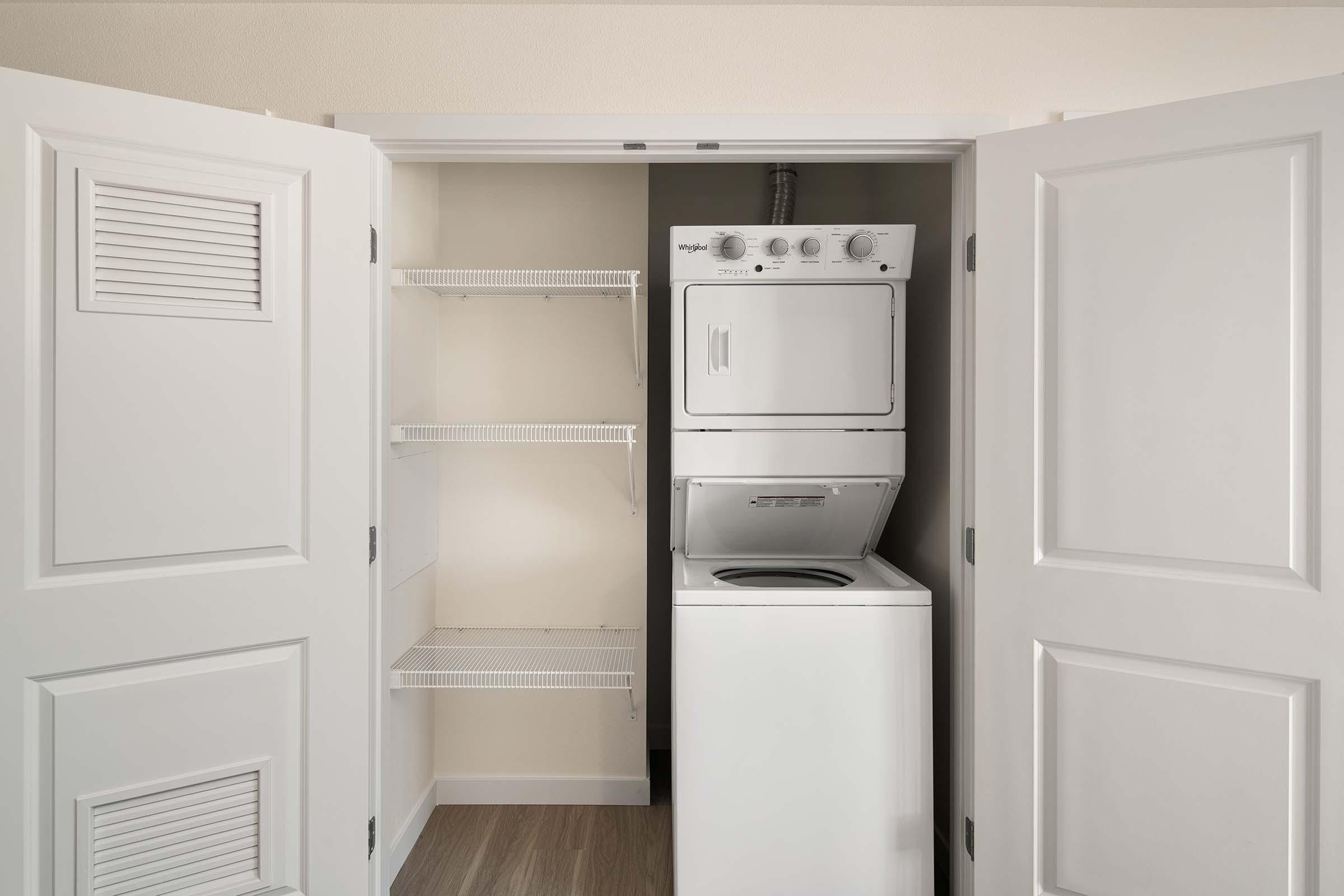 a microwave oven sitting on top of a refrigerator