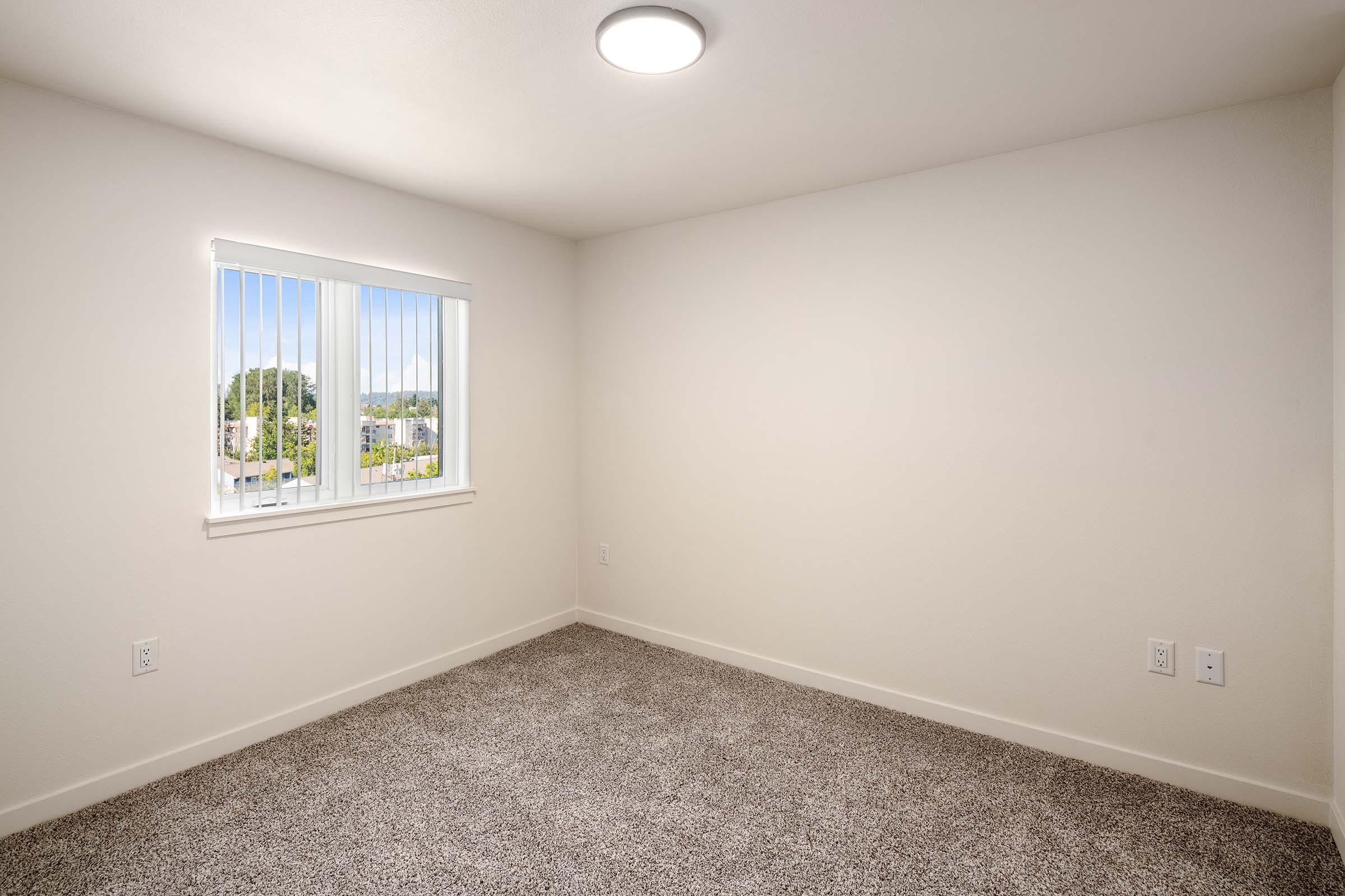 a bedroom with a large mirror