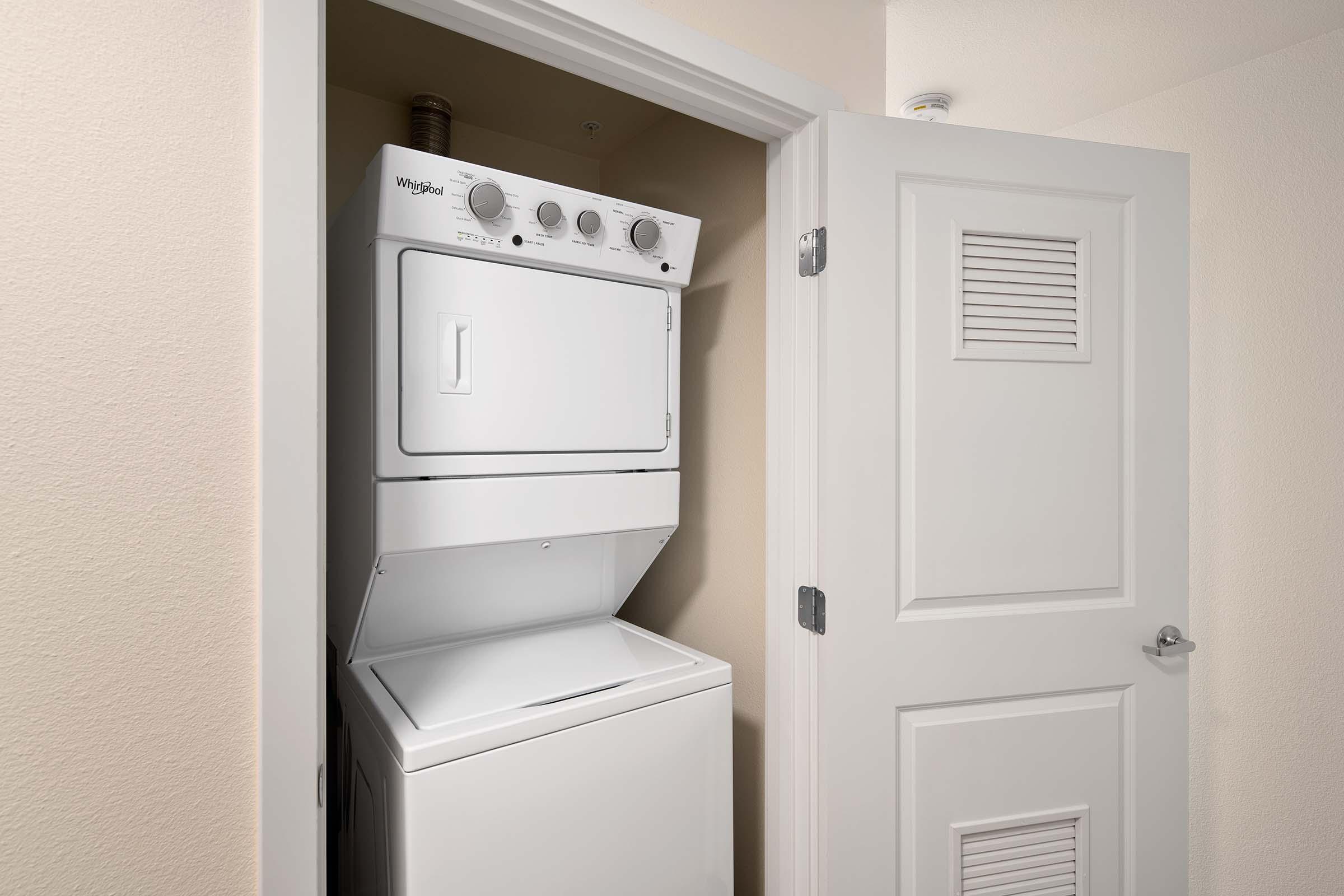 a refrigerator freezer sitting next to a door