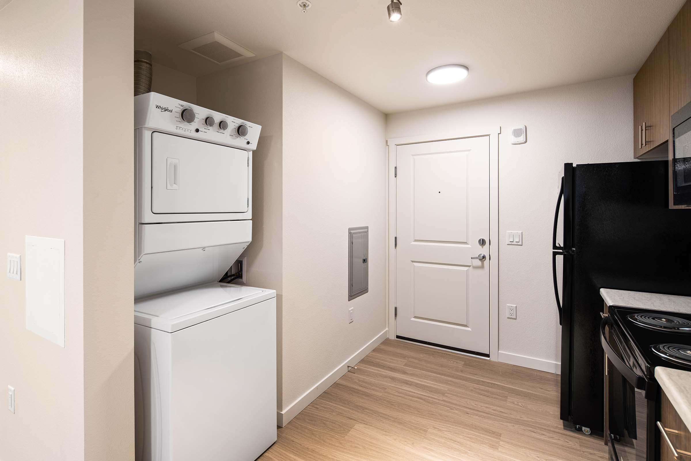 a kitchen with a stove and a refrigerator