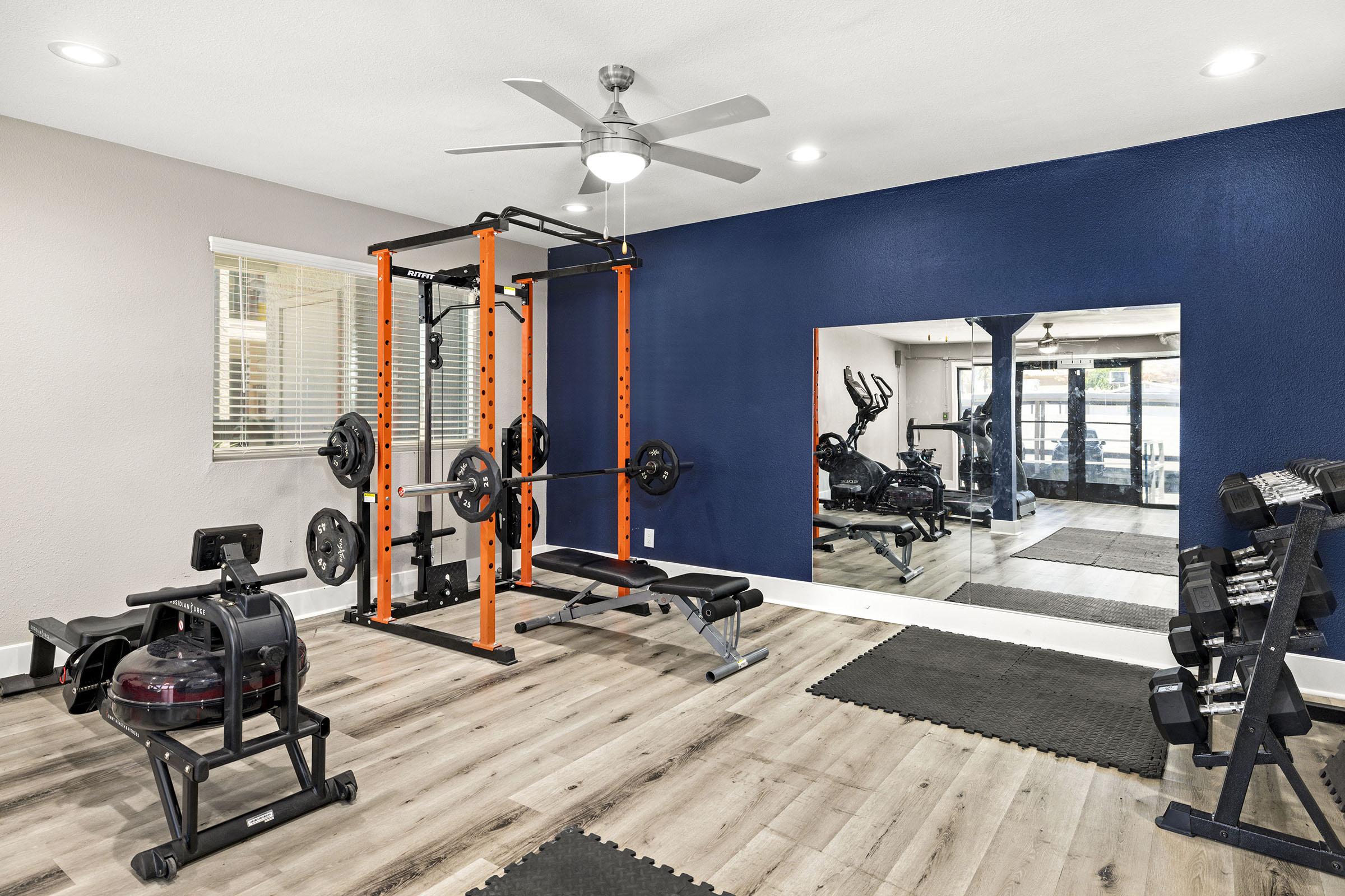 Fitness room with exercise equipment.