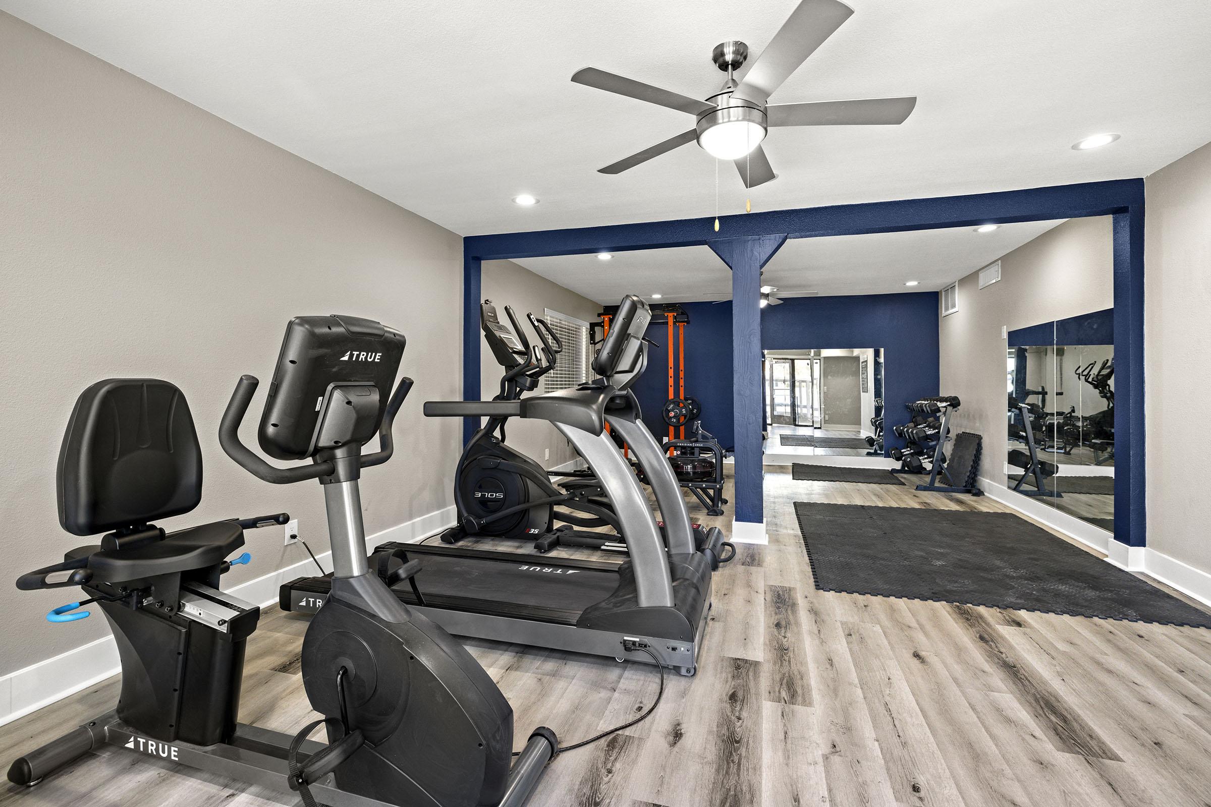 Fitness room with exercise equipment.
