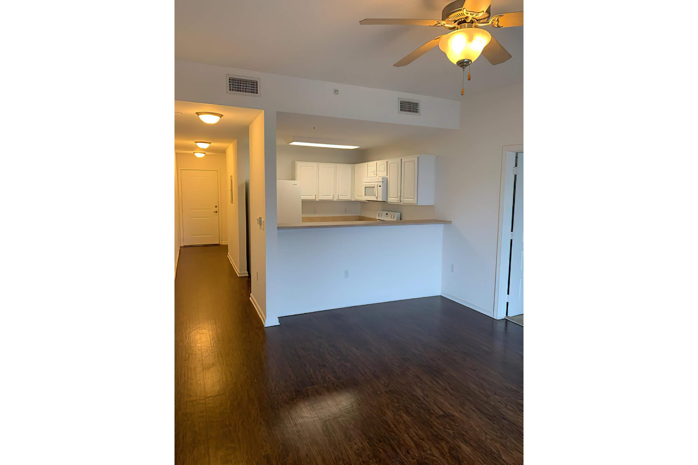 a kitchen with a building in the background