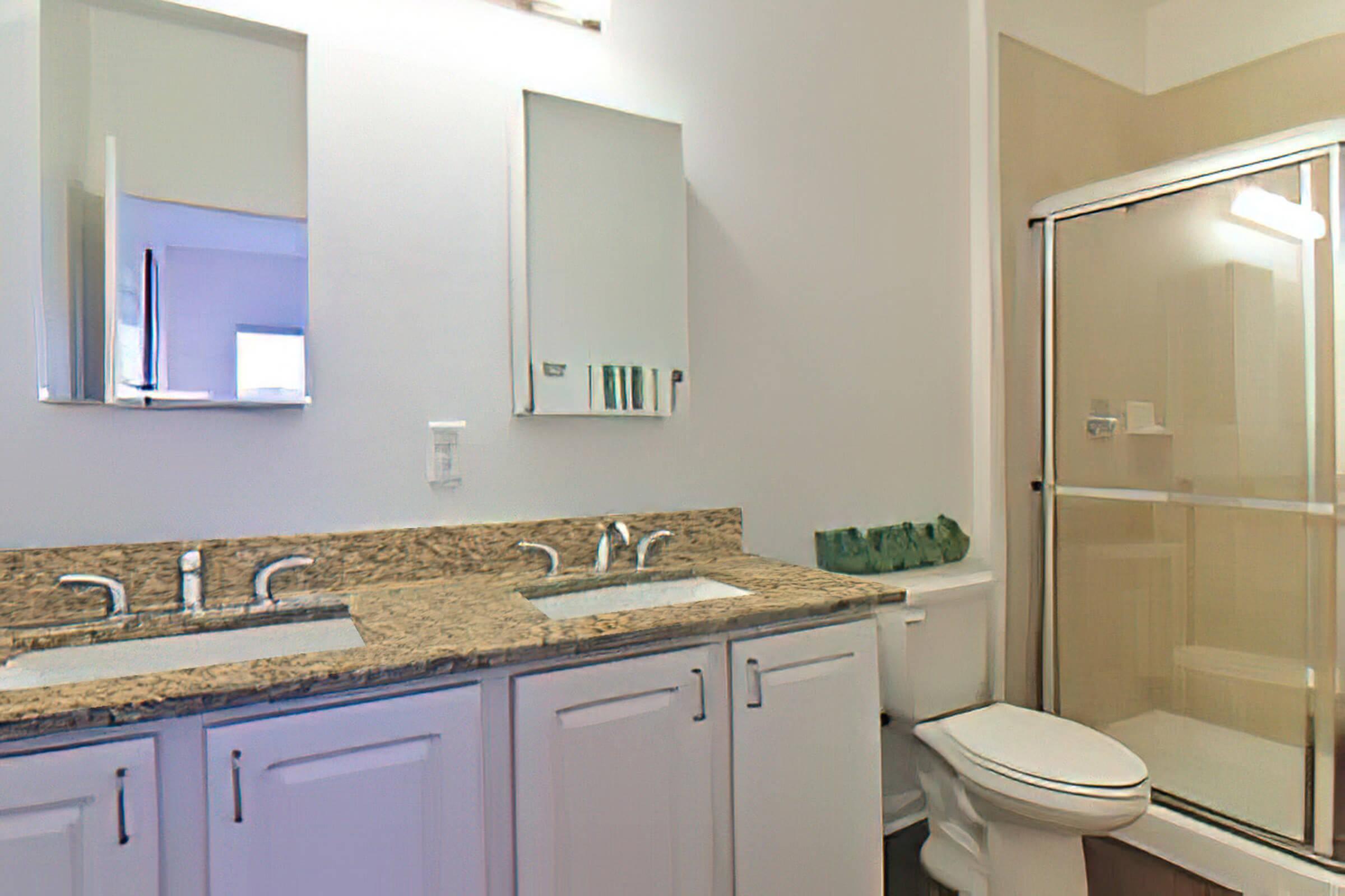 a kitchen with a sink and a mirror