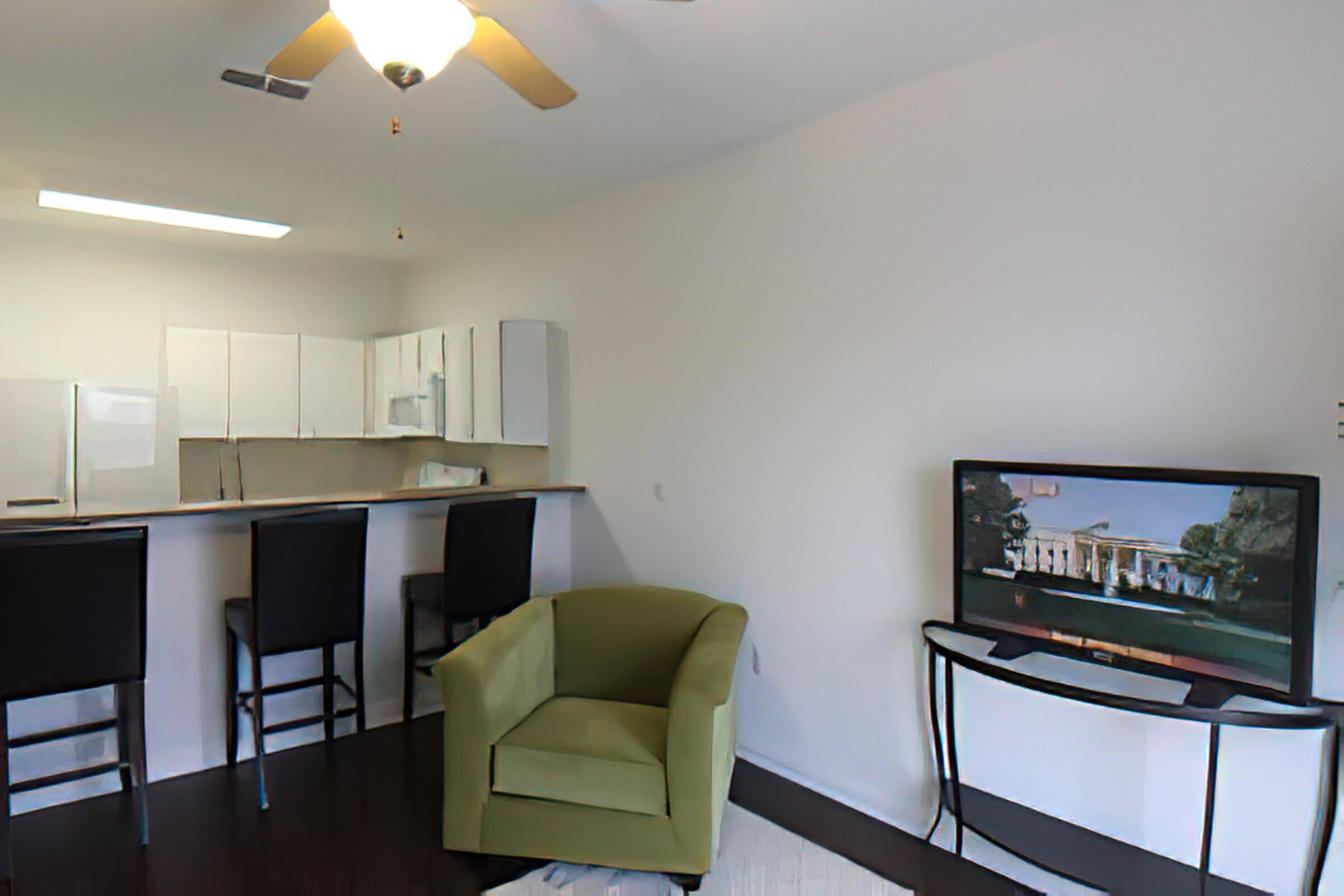 a living room filled with furniture and a flat screen tv