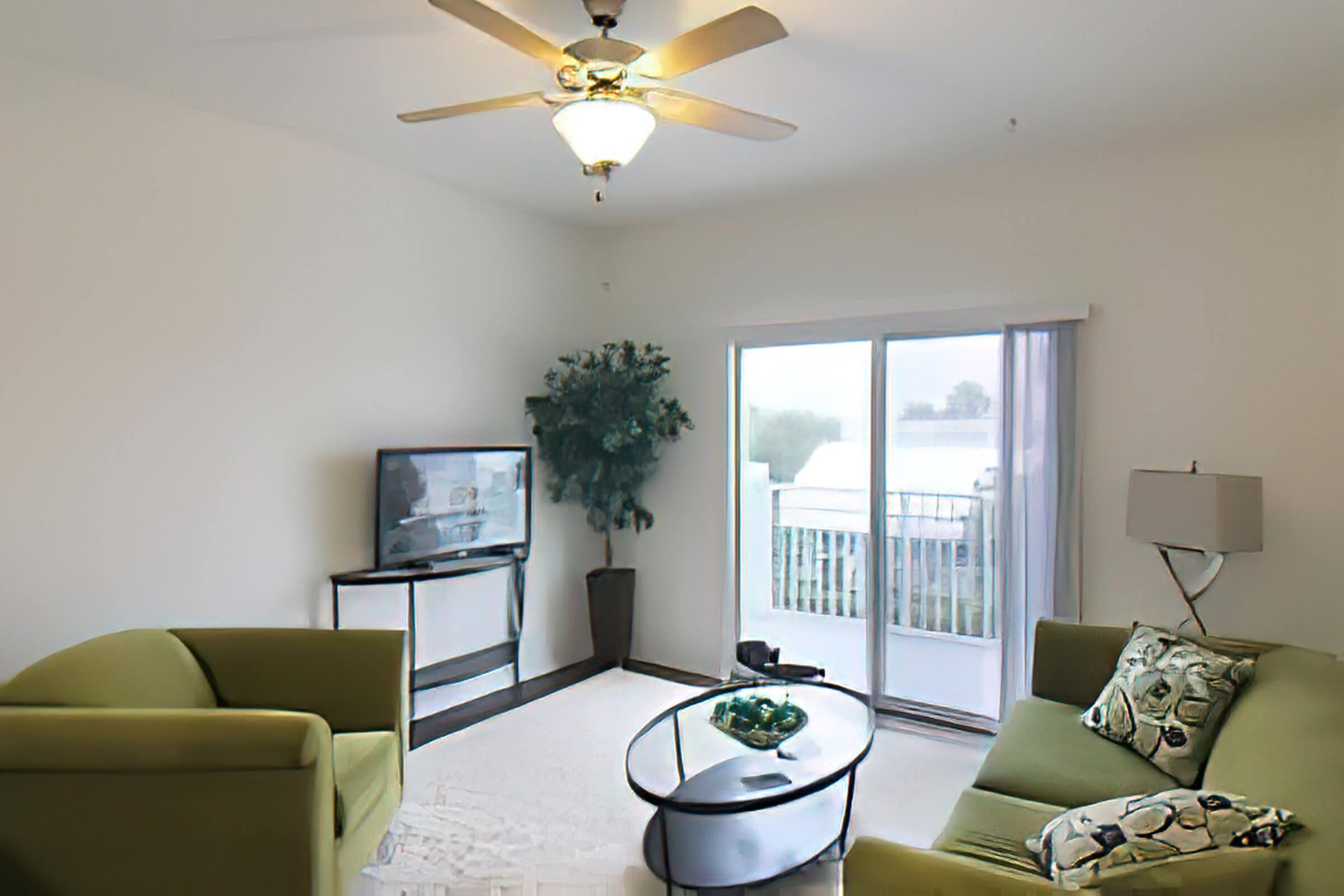 a living room filled with furniture and a large window