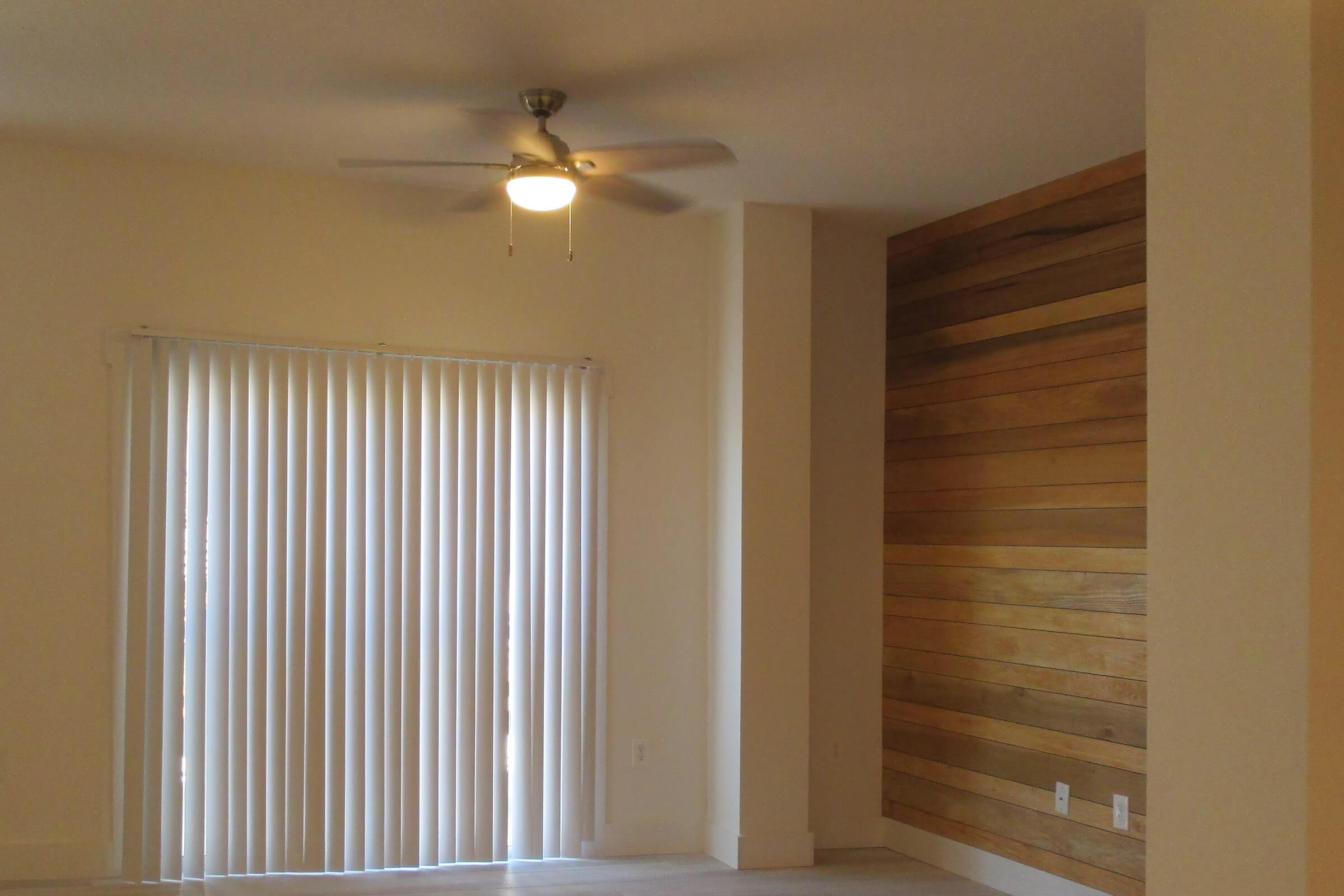 a bedroom with a large window