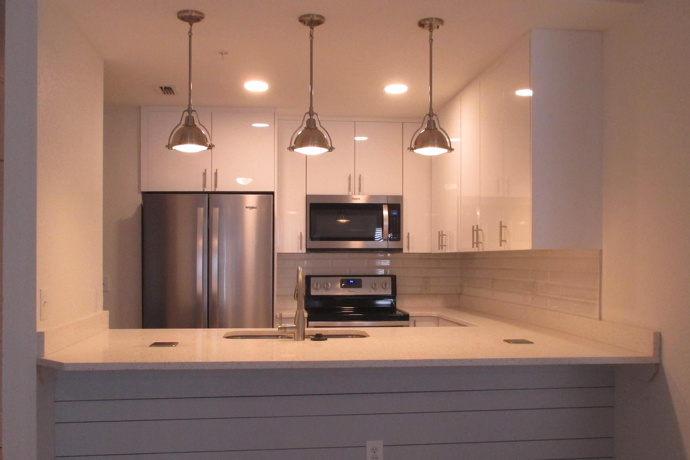 a modern kitchen with stainless steel appliances