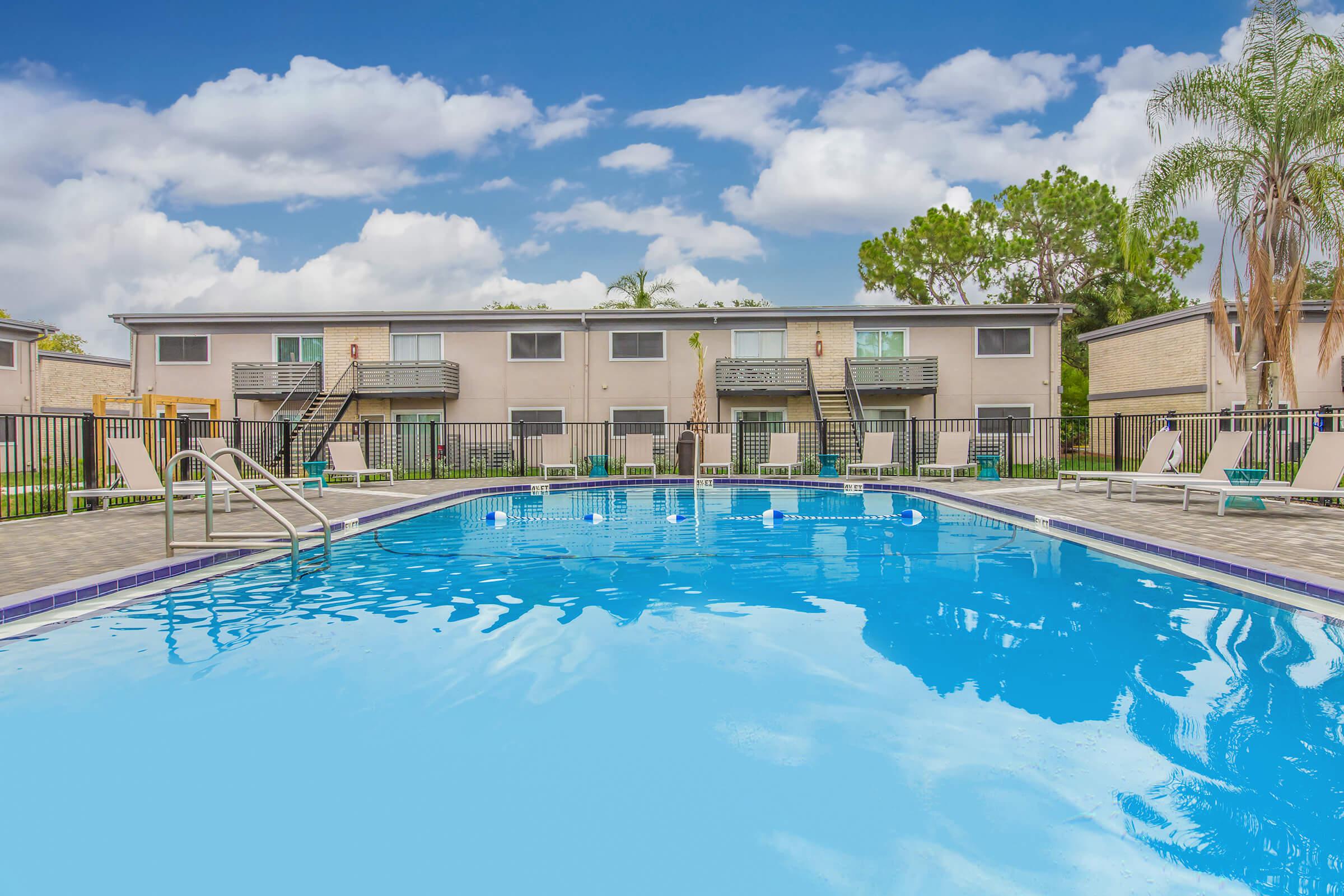 DIP YOUR TOES IN OUR SHIMMERING SWIMMING POOL AT  THE CROSSINGS AT 66TH APARTMENTS