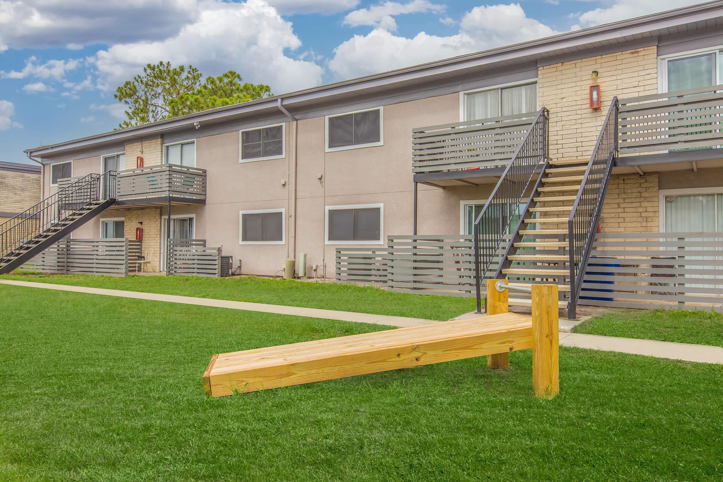 a large lawn in front of a building