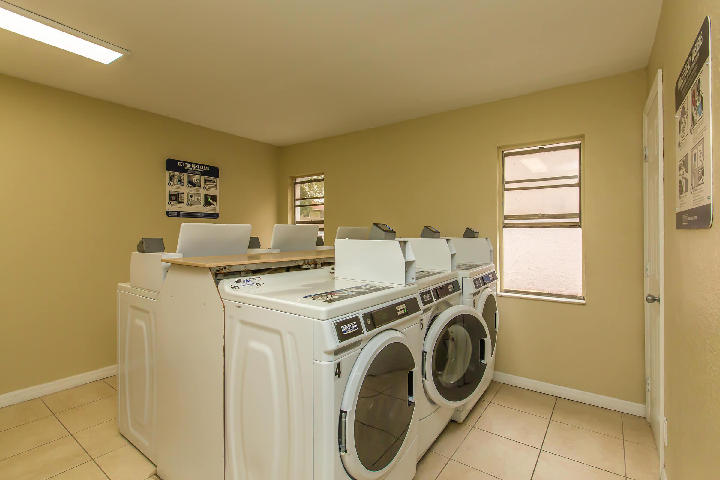 a room with a sink and a microwave