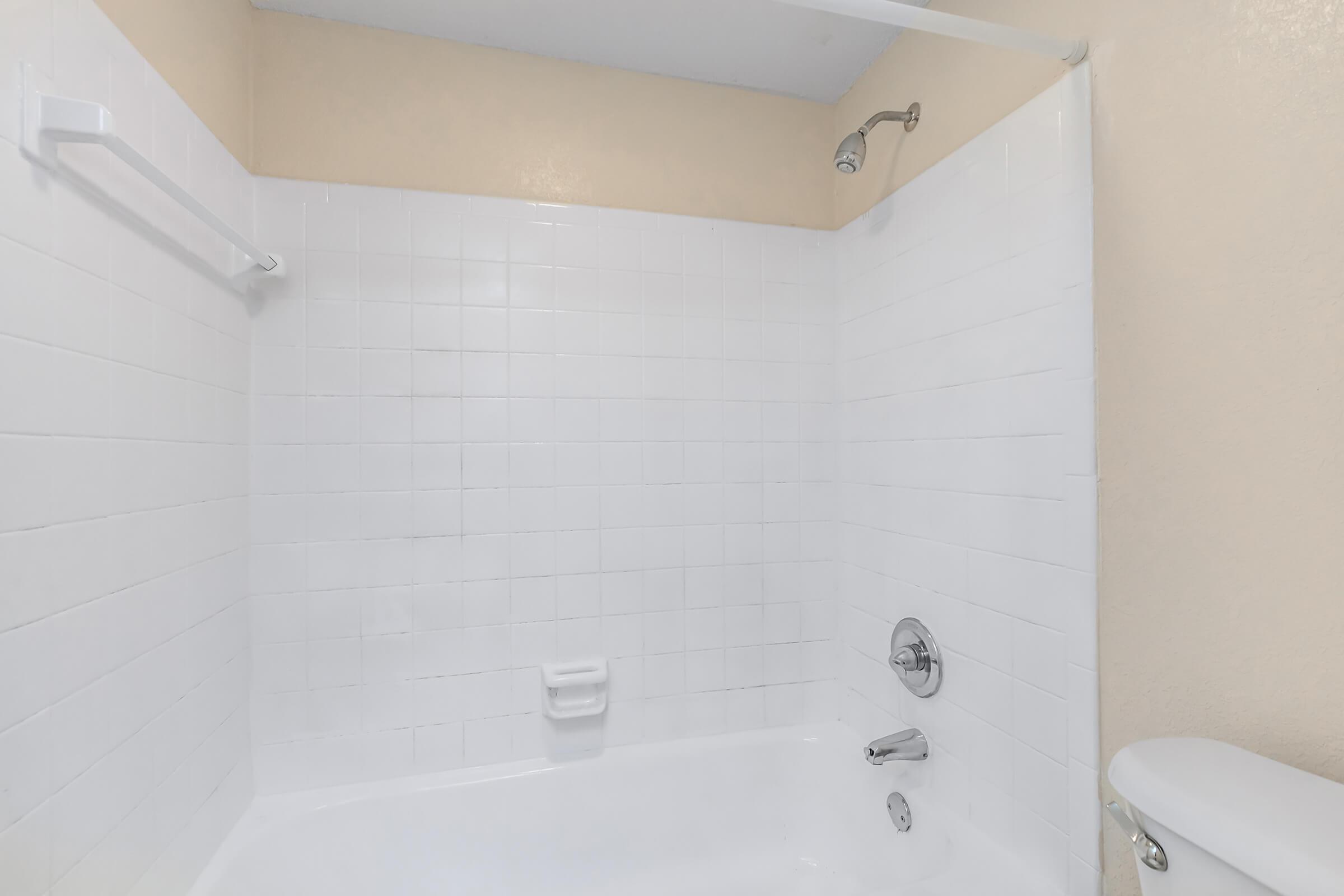 a room with a sink and a bath tub