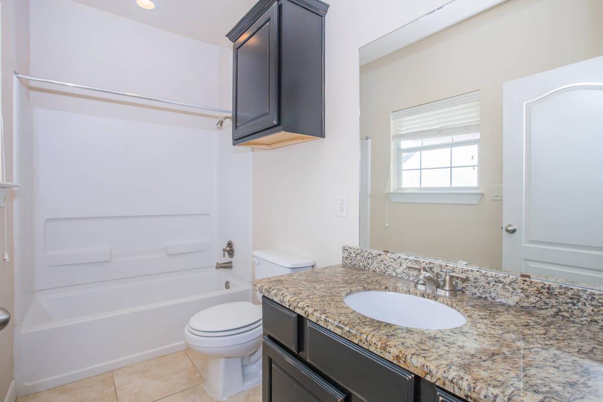 a kitchen with a sink and a window