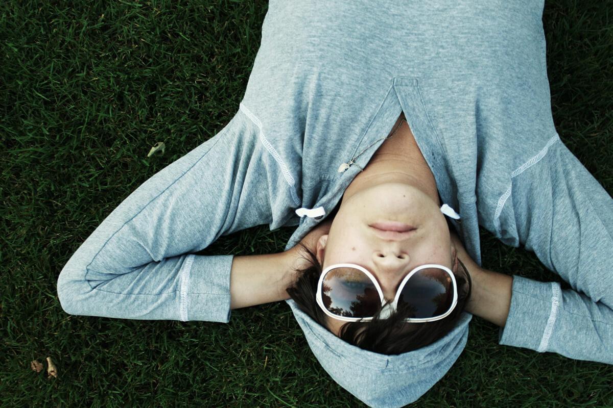 a person sitting on the grass