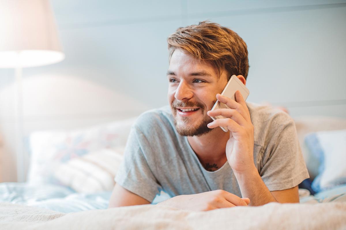 a man sitting on a bed