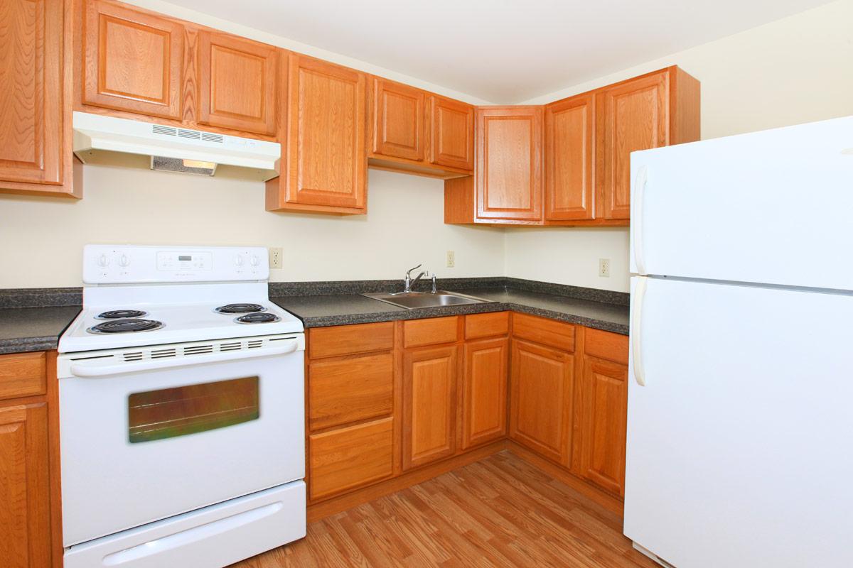 a kitchen with a stove top oven sitting inside of a refrigerator