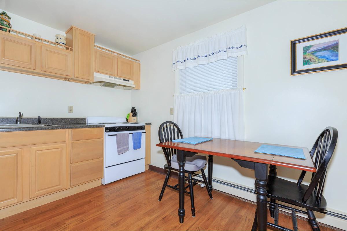 a kitchen with a wood floor