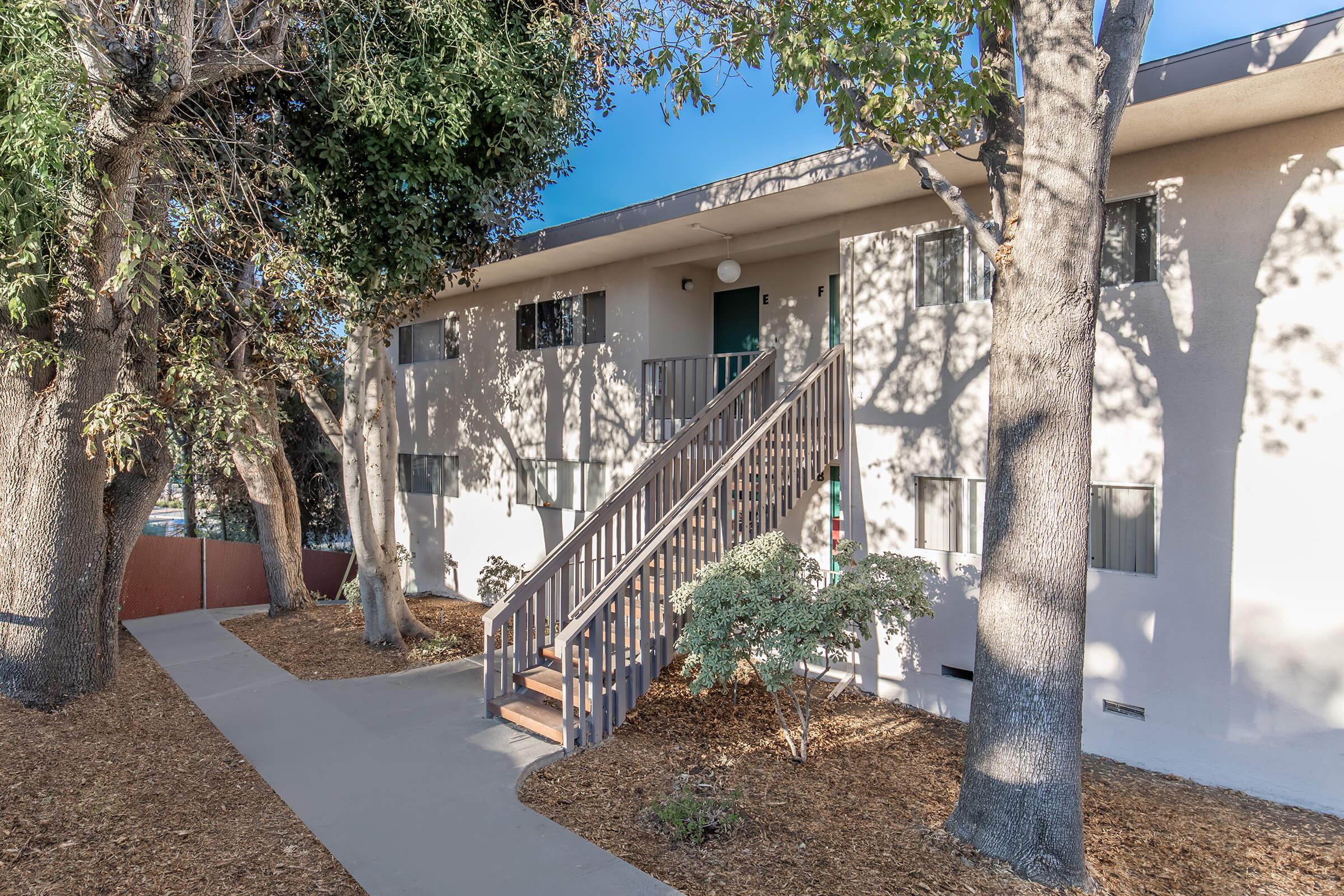 a house with trees in the background