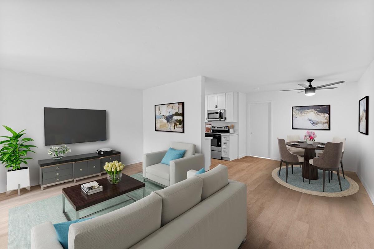 a living room filled with furniture and a flat screen tv