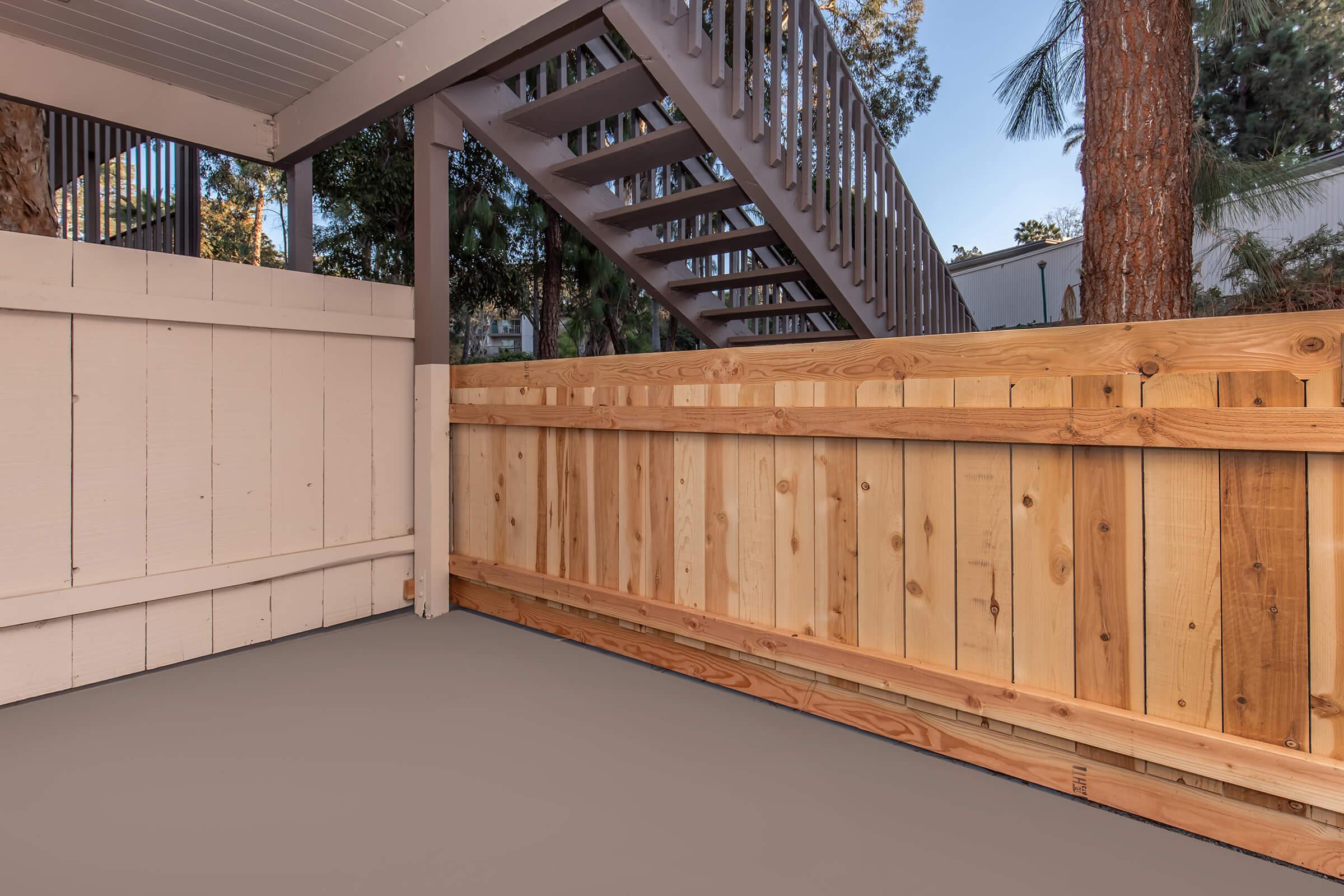 a building with a wooden fence