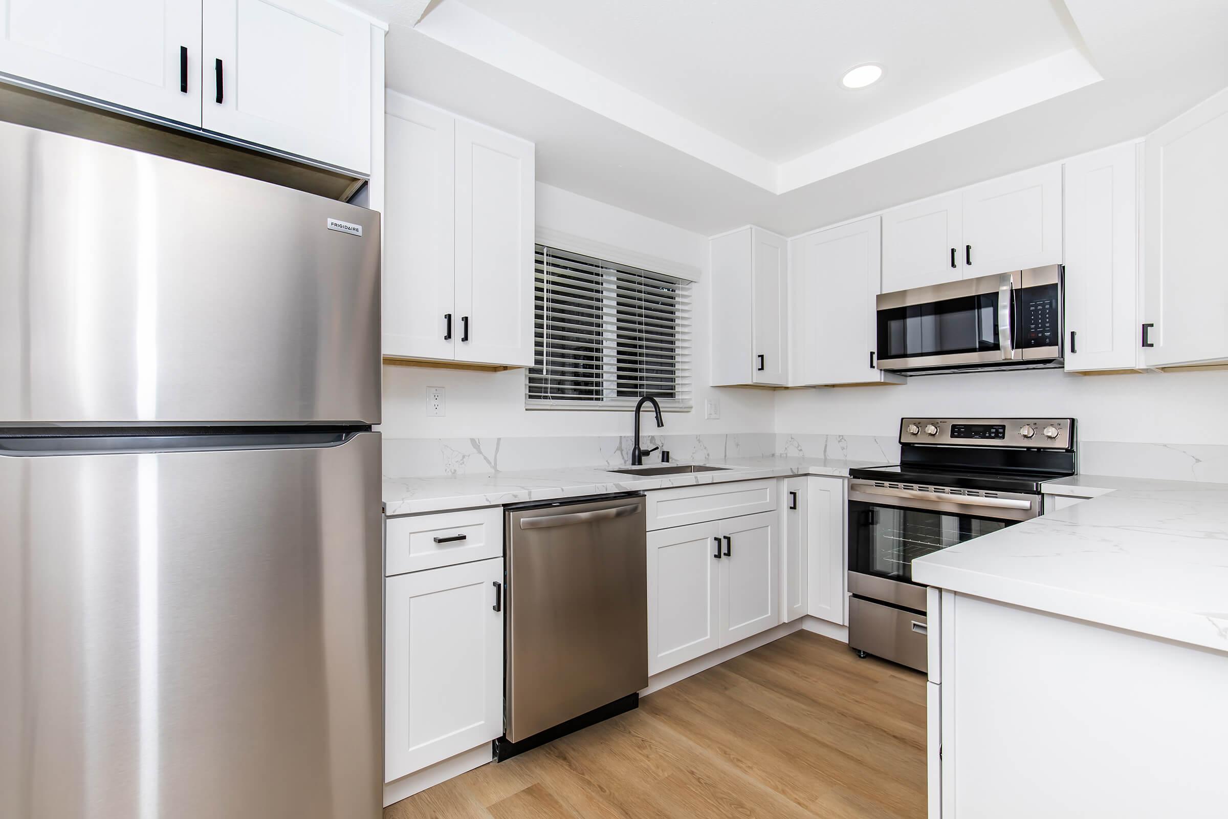 a stainless steel refrigerator in a kitchen