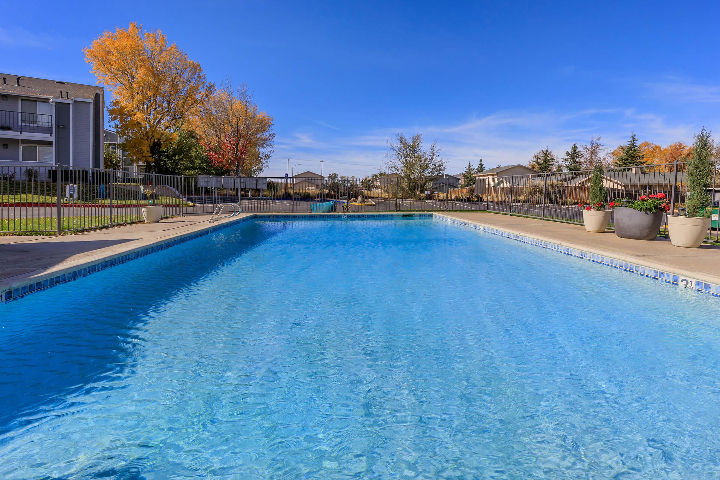 a pool next to a body of water