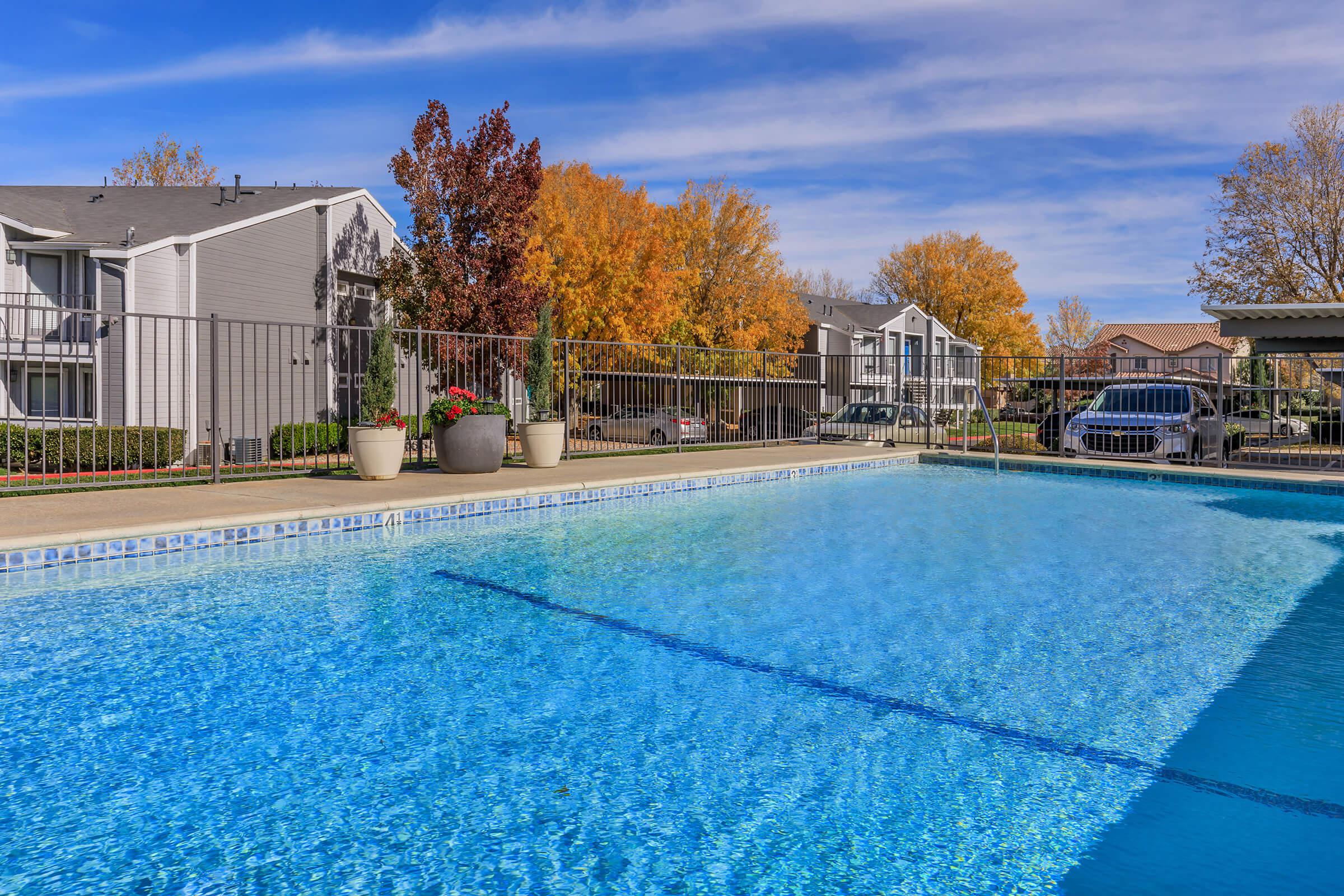 a pool next to a body of water