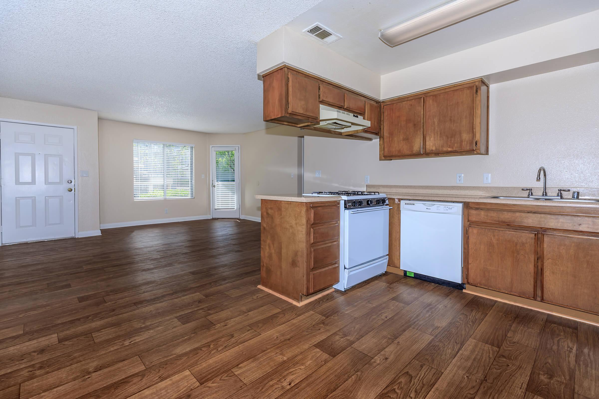 a kitchen with a wood floor