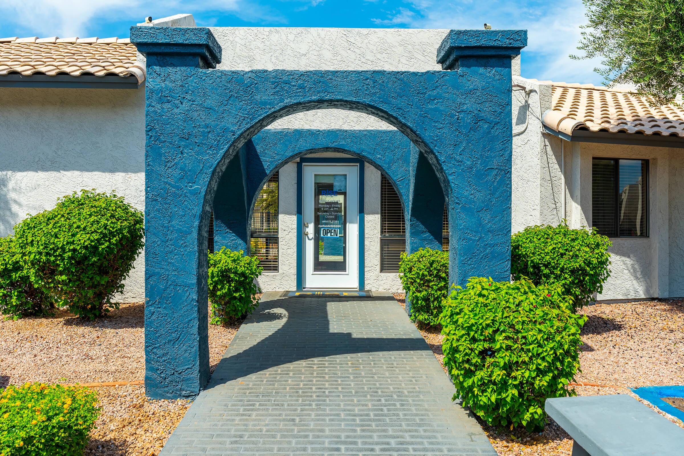 The leasing office with an open sign at Rise Thunderbird. 