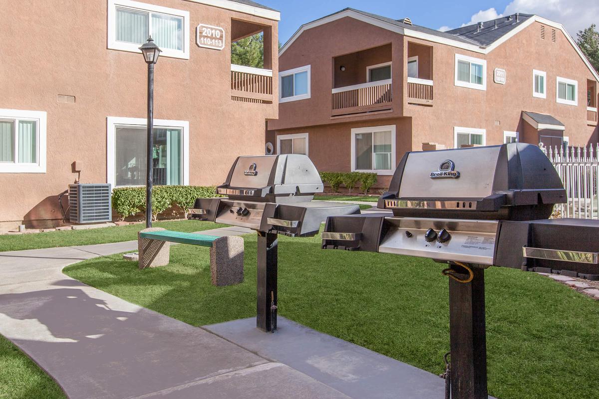a house with a lawn in front of a building