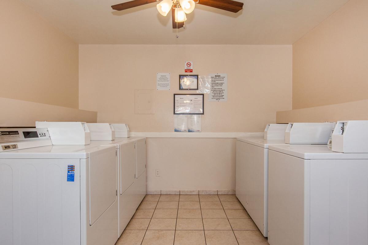 a white refrigerator freezer sitting inside of a kitchen