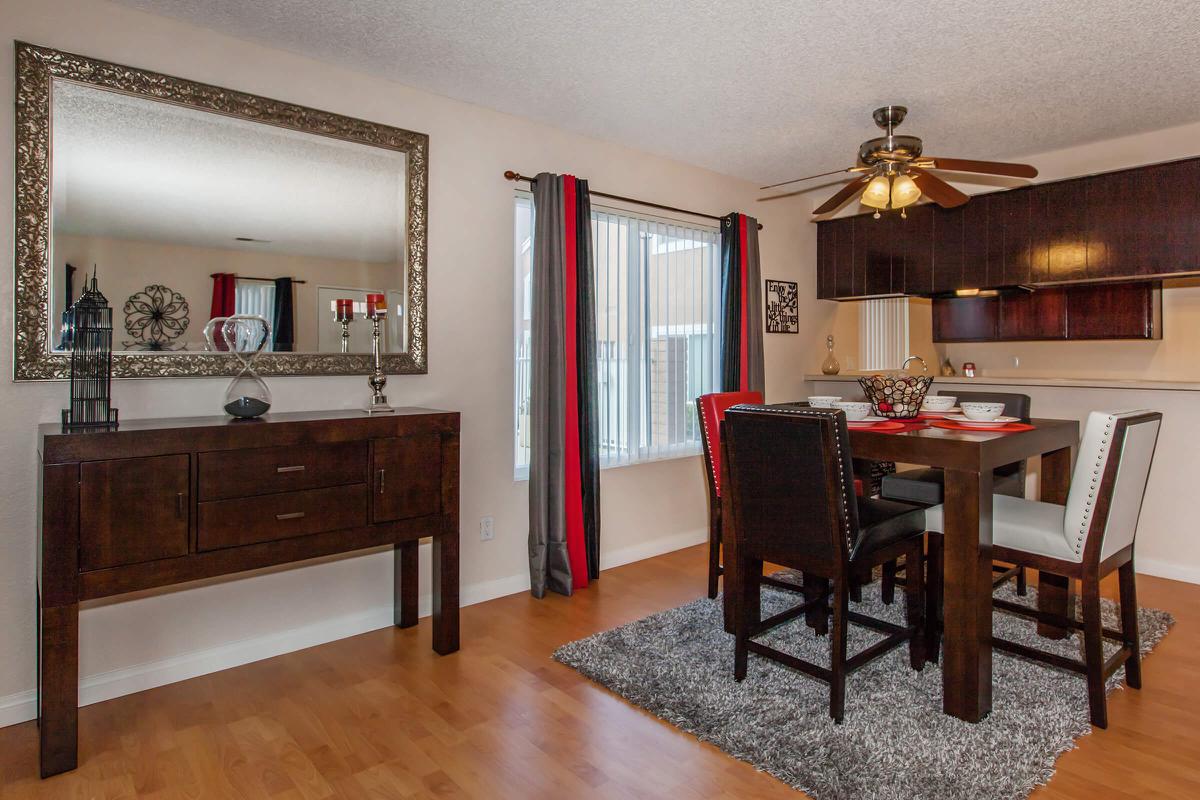 a bedroom with a bed and desk in a room