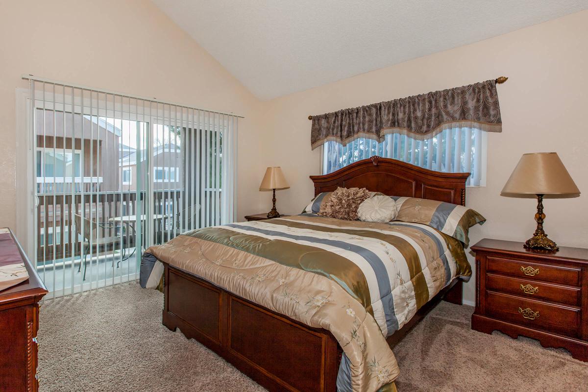 a bedroom with a bed in a hotel room