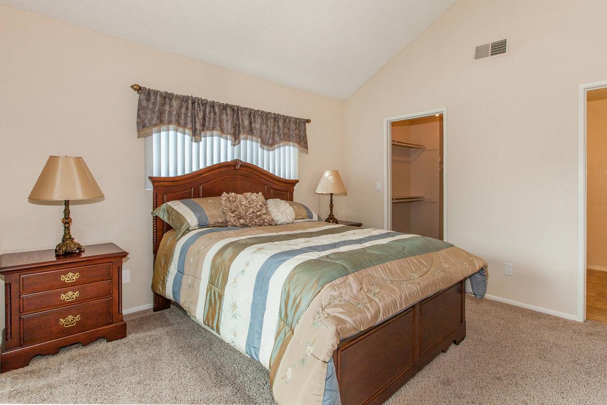 a bedroom with a bed in a hotel room