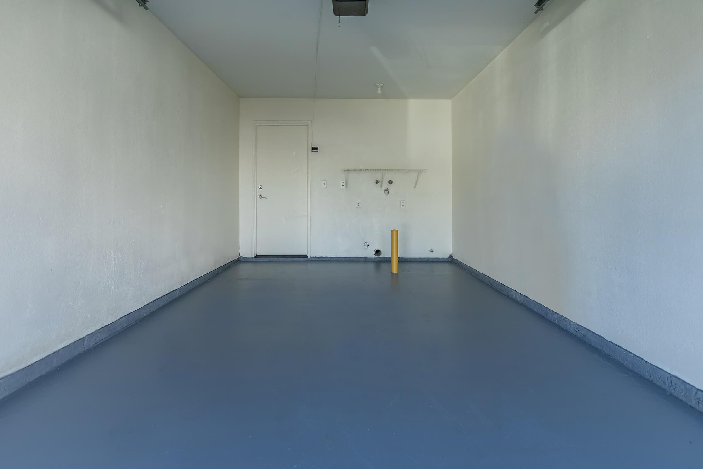 a kitchen area with a building in the background