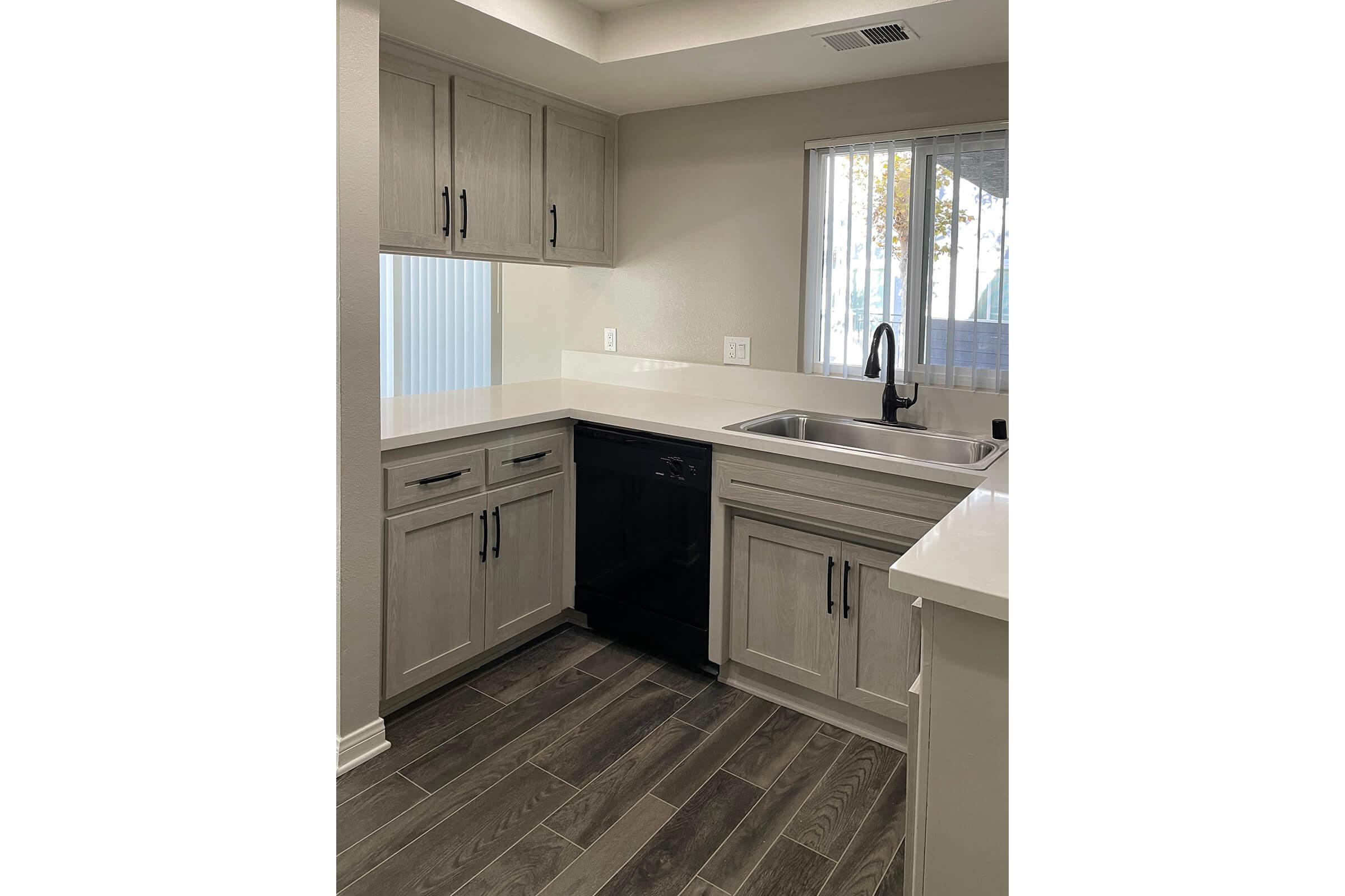 a stove top oven sitting inside of a kitchen