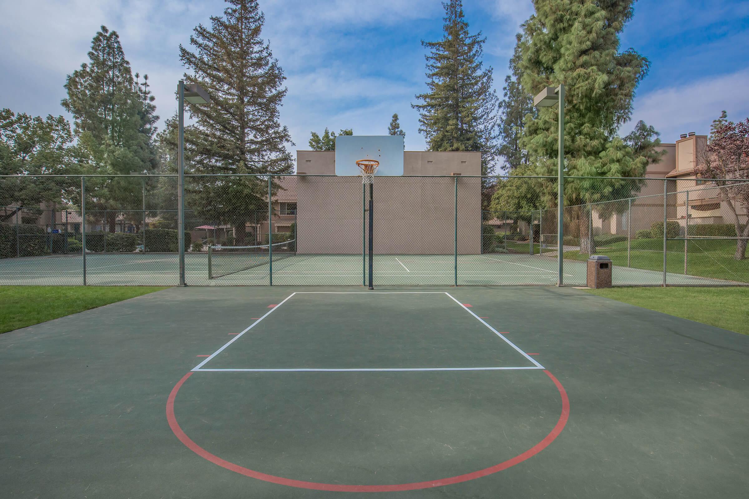 a basketball on a court with a racket