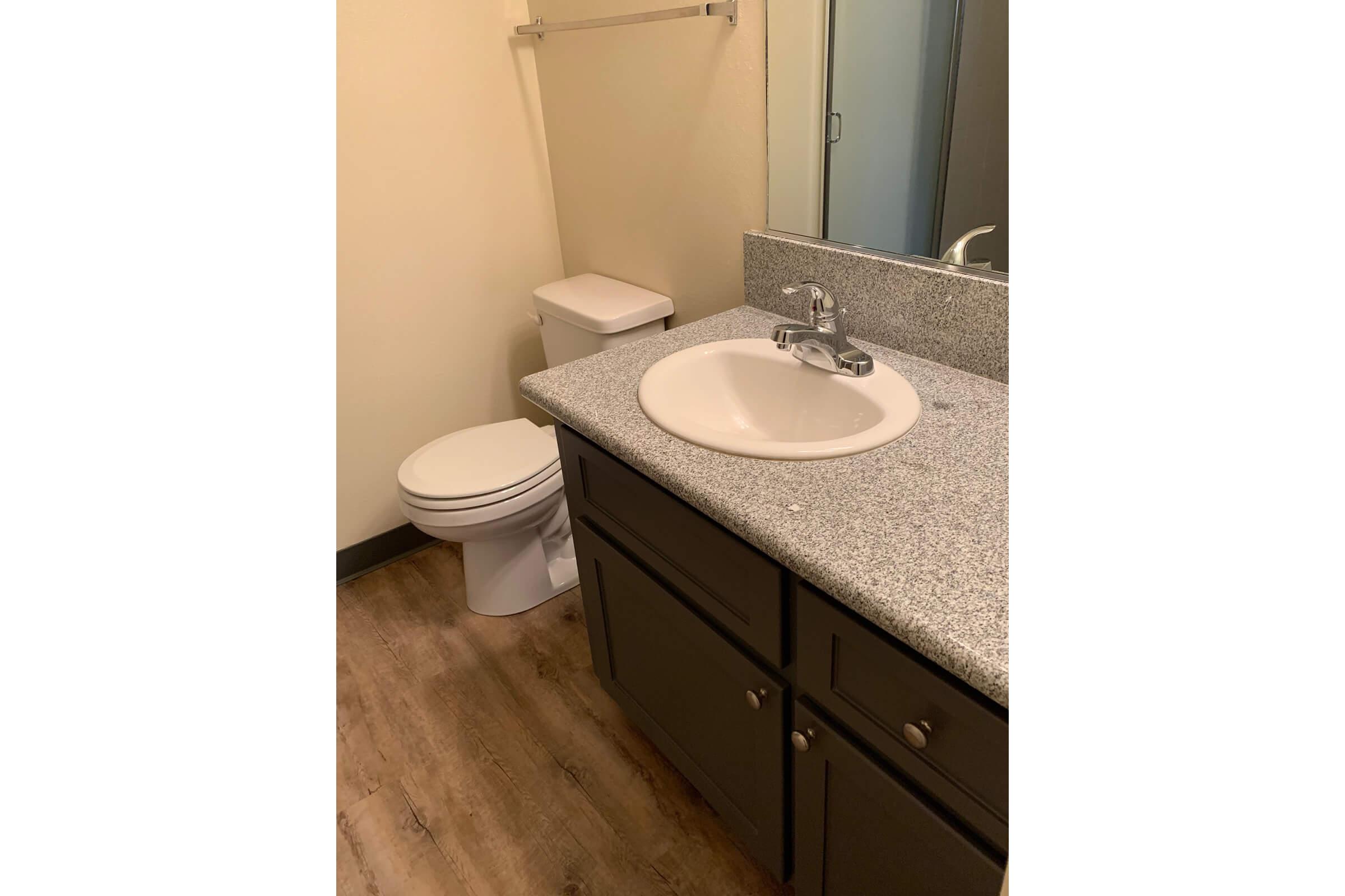 a small white sink in a bathroom