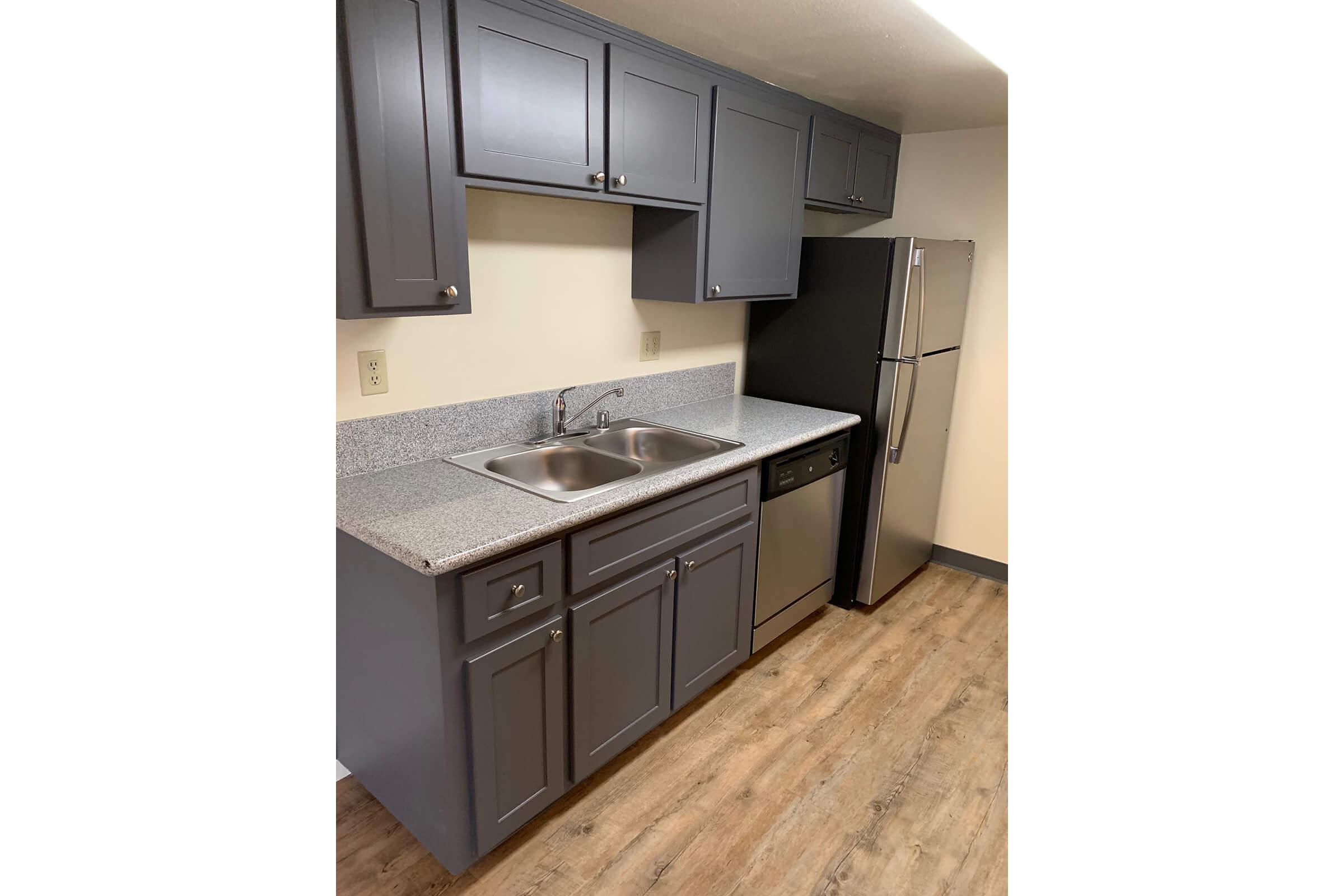 a stainless steel refrigerator in a kitchen