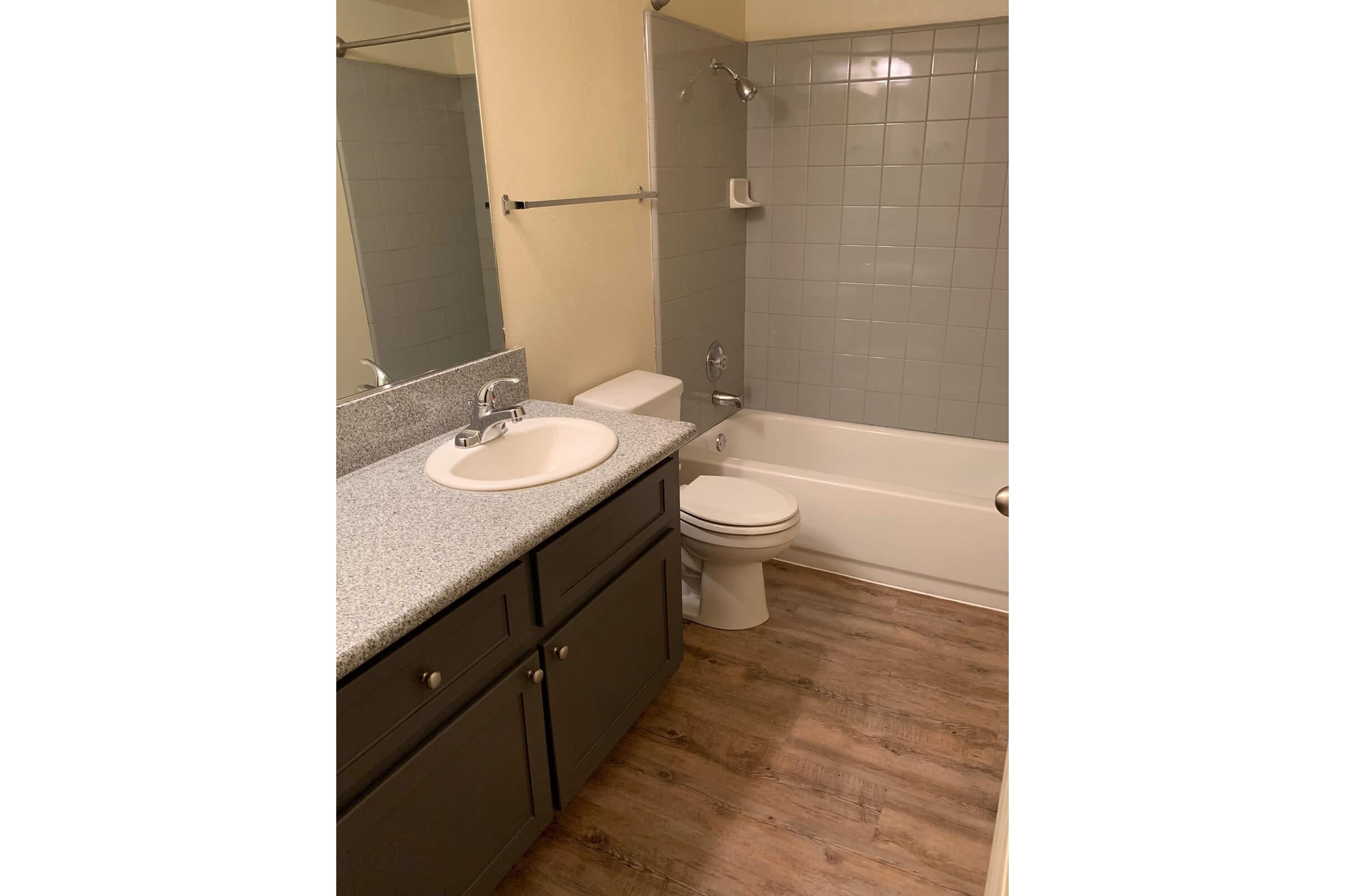 a small white sink in a bathroom