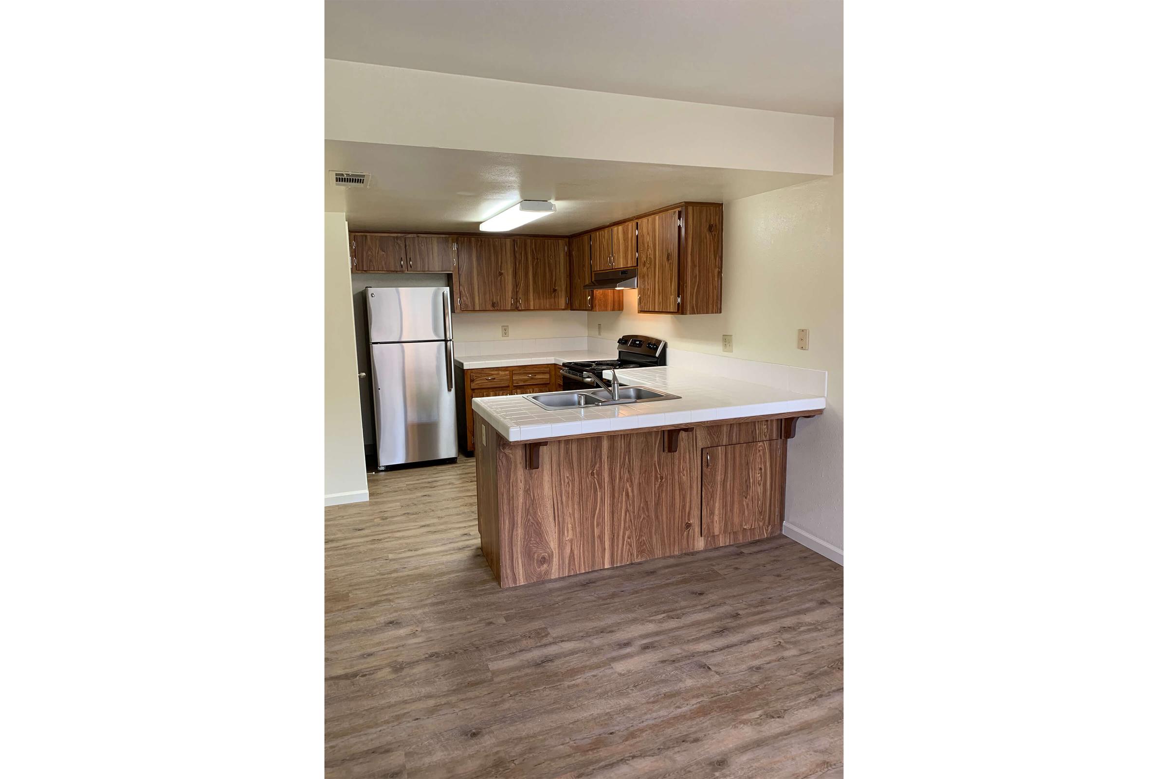 a kitchen with a wood floor