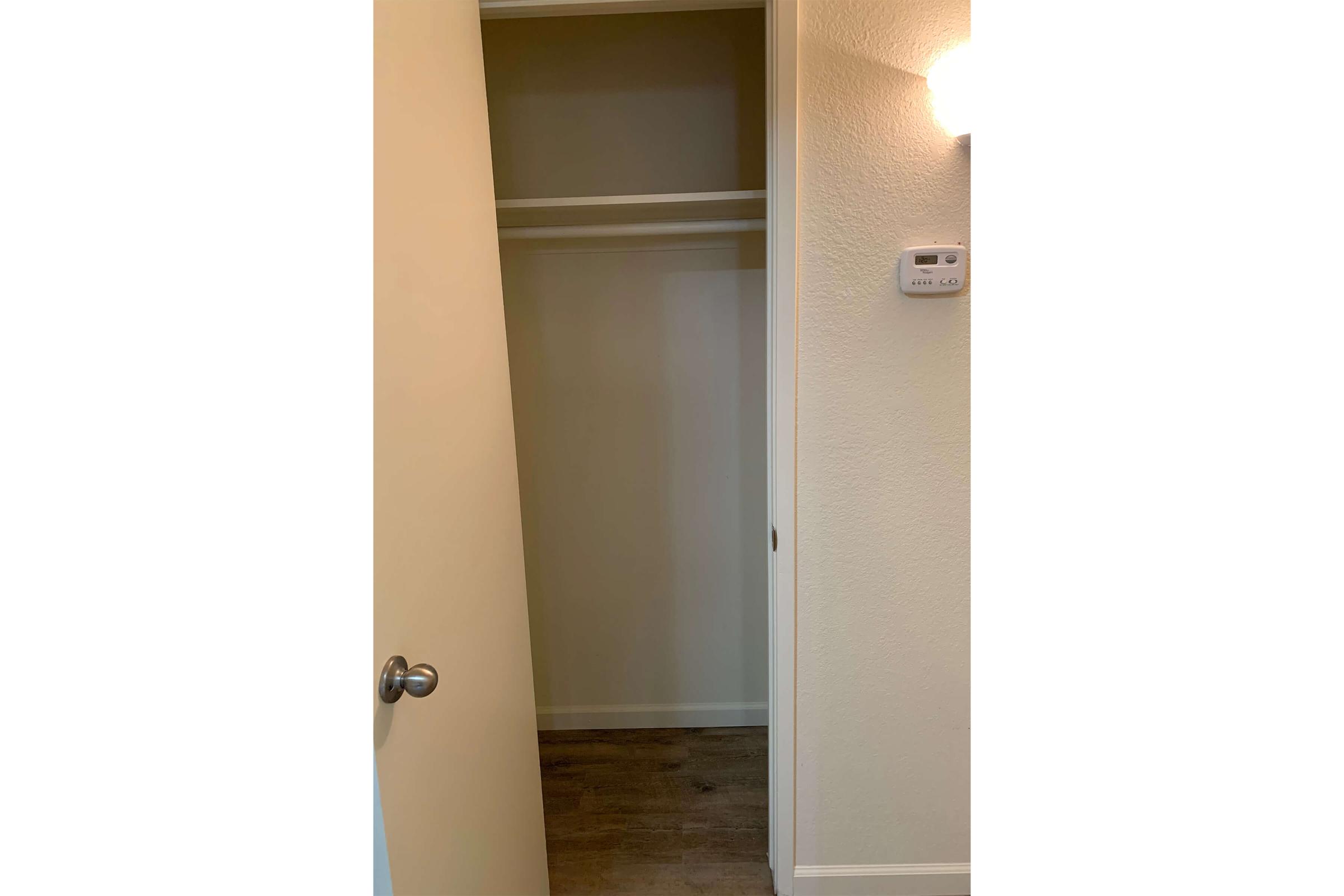 a white refrigerator freezer sitting next to a door