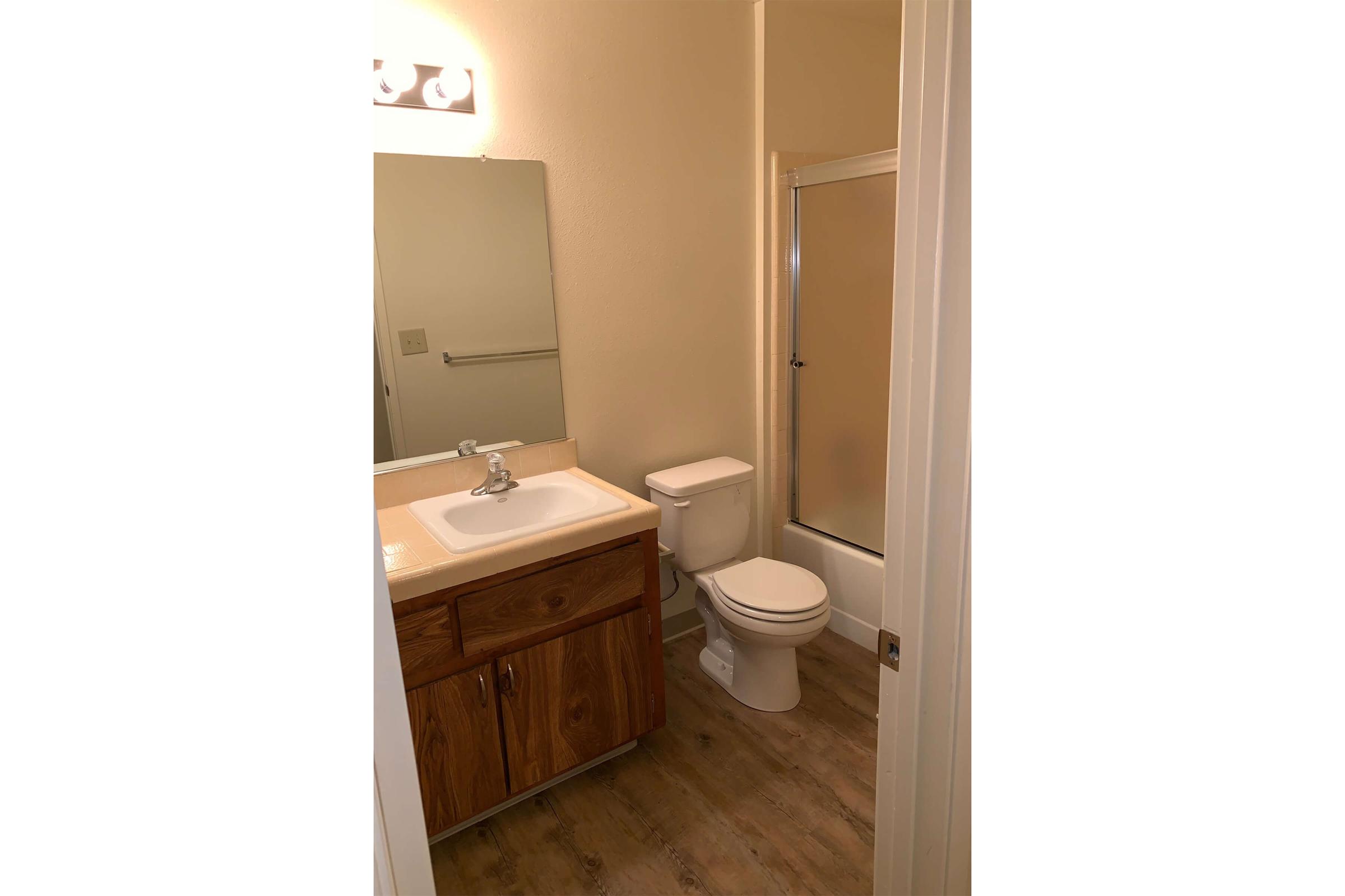 a white sink sitting next to a door