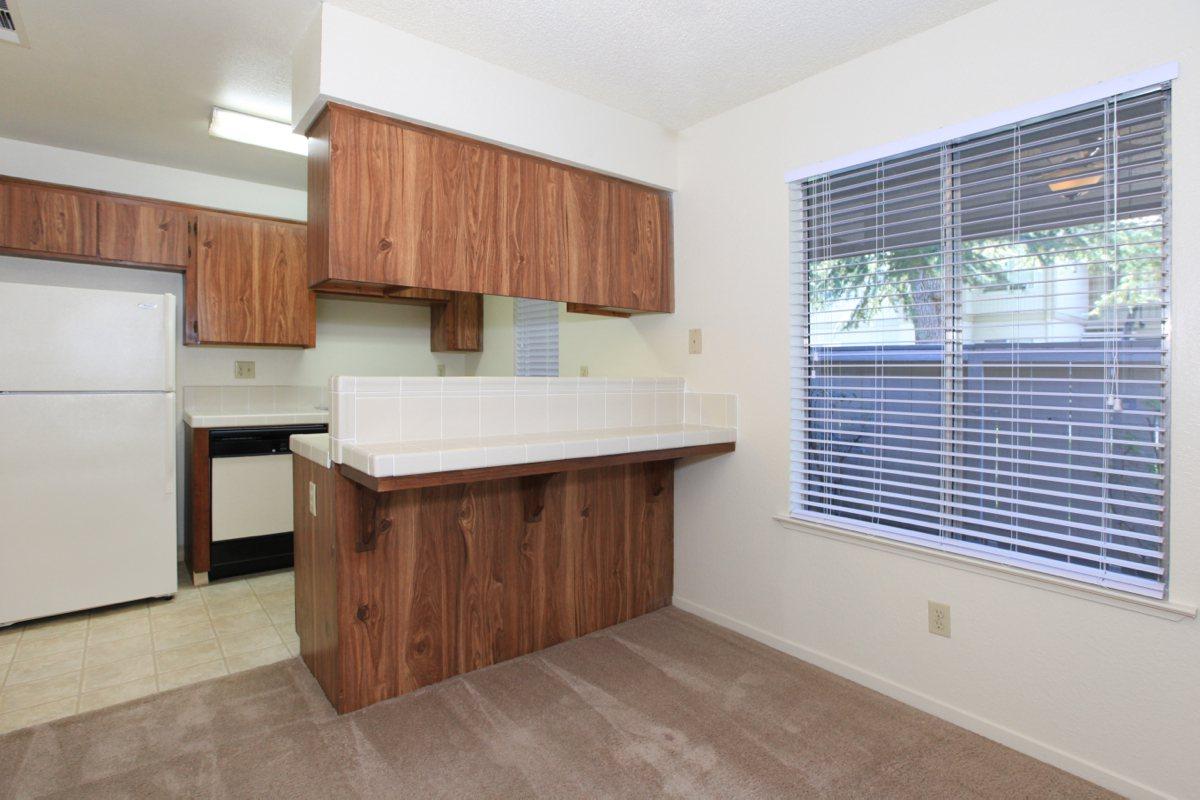 a kitchen with a wood floor