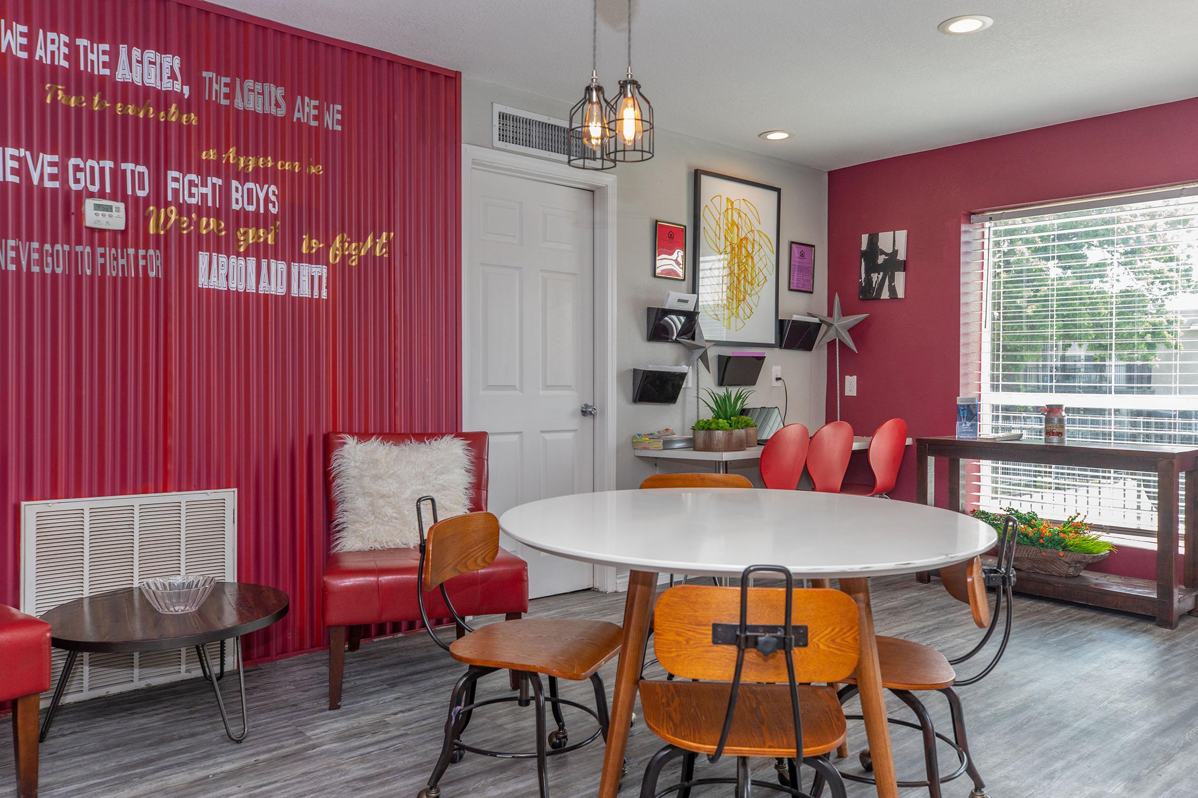 a dining room table in front of a window