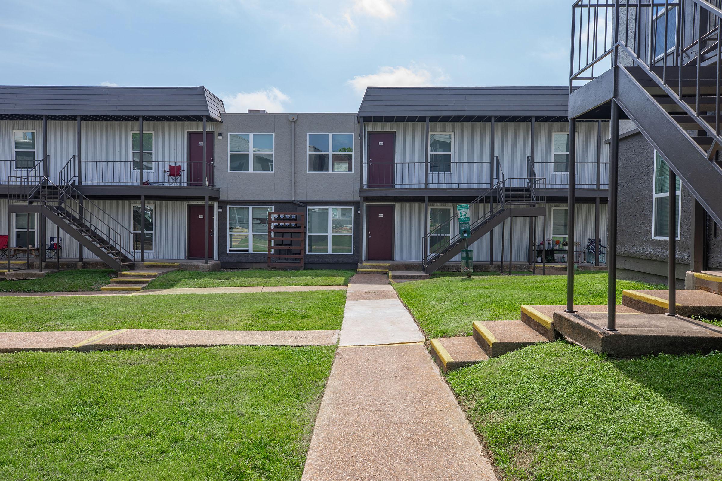 a large lawn in front of a house