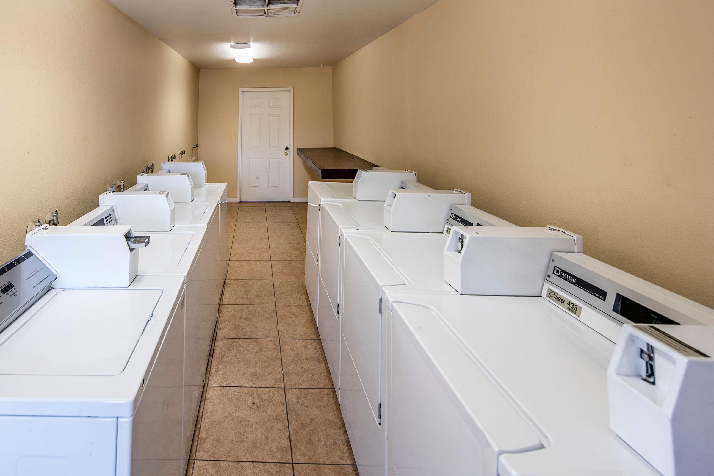 a kitchen with a sink and a refrigerator