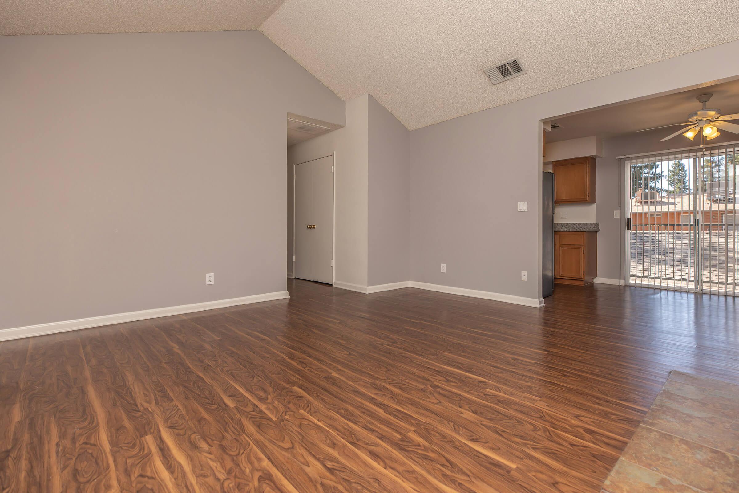 a large empty room with a wooden floor